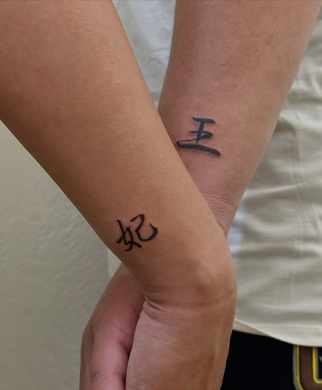Chinese characters tattoo on the forearm by Tattoo Takayo