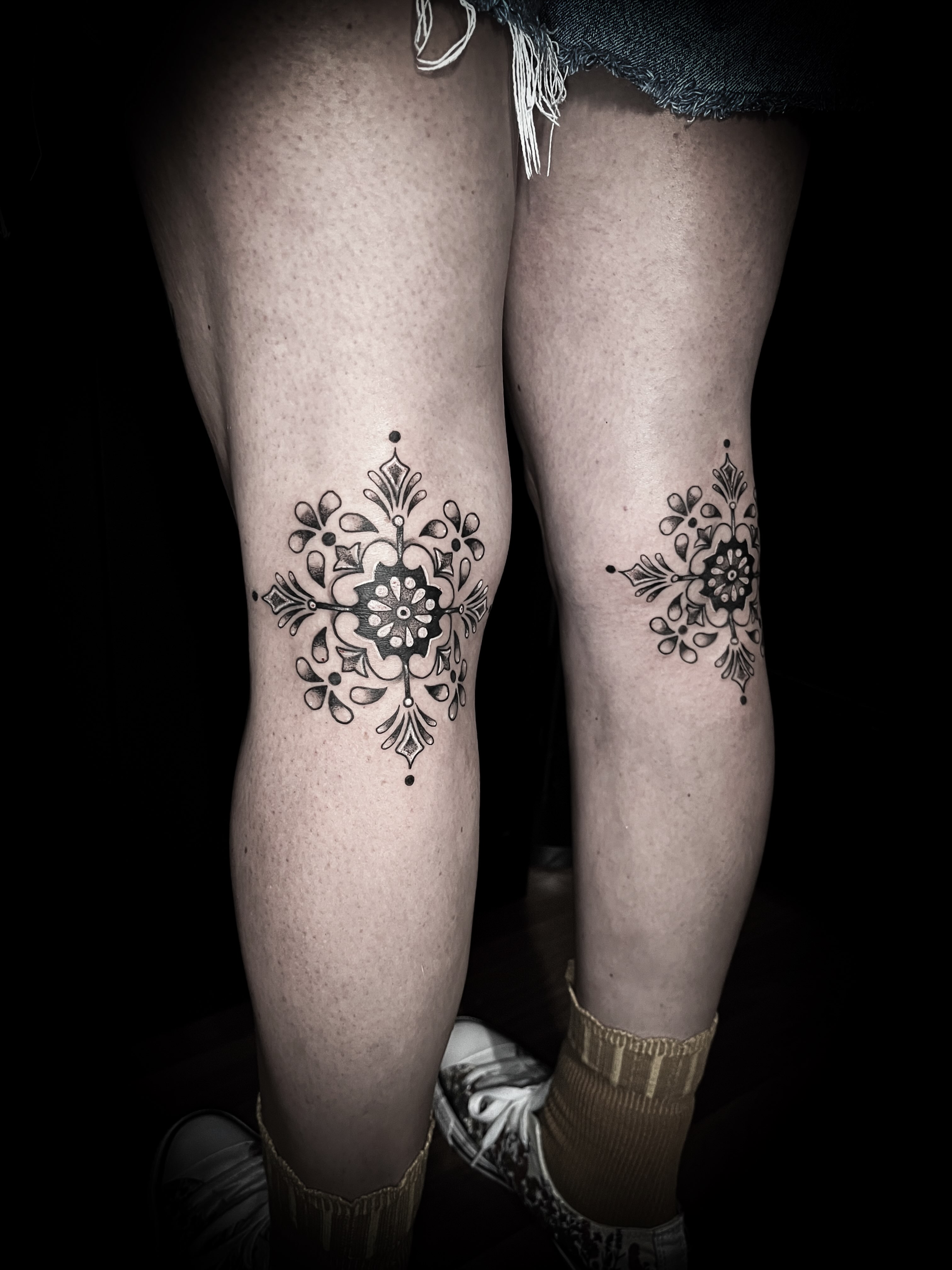 Floral ornament black and grey tattoo on the leg by Lindsay Fernandez, Colorado Springs, Colorado