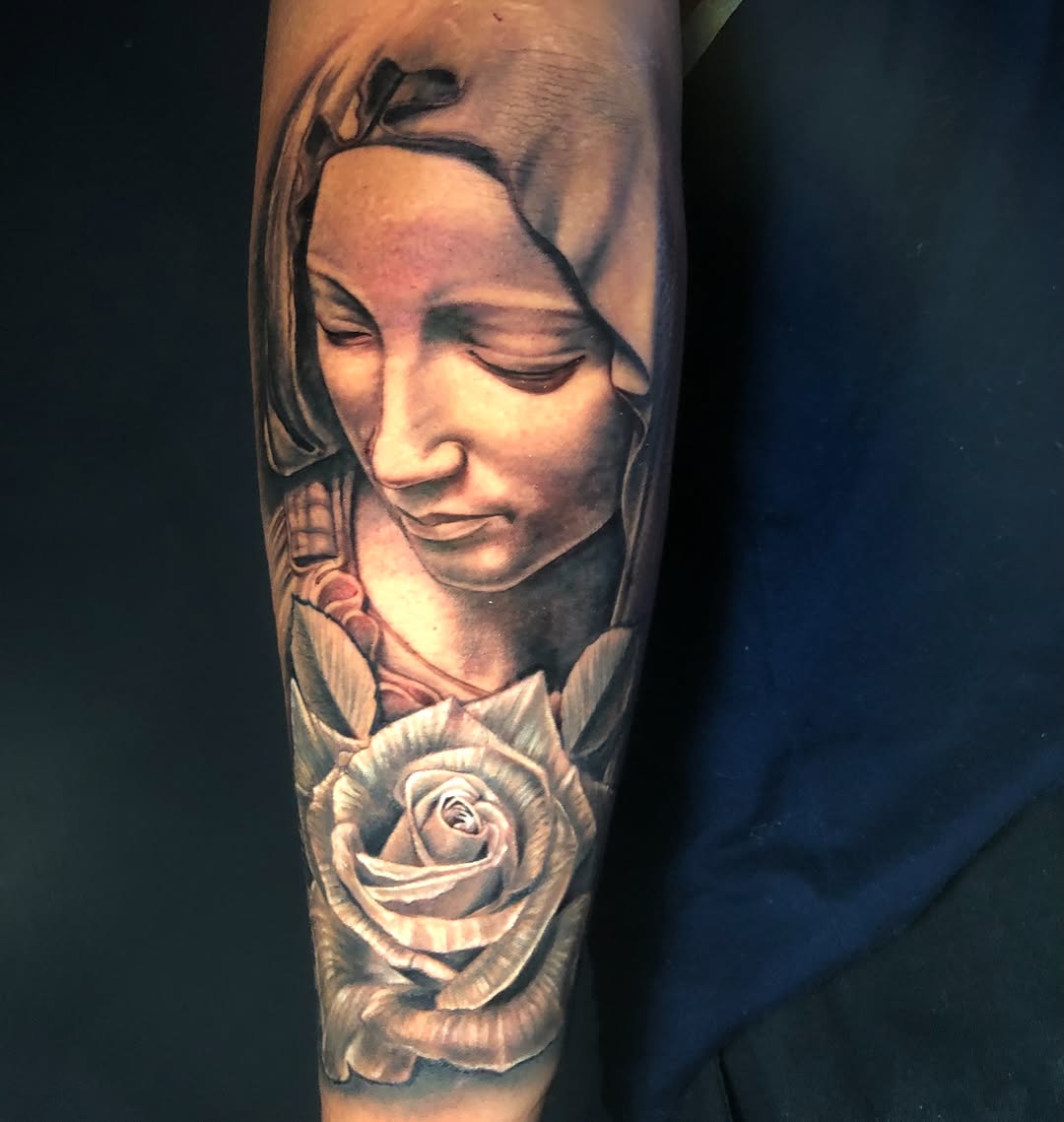 Virgin Mary and rose Chicano tattoo on the forearm by Kayden DiGiovanni, Addison, Texas