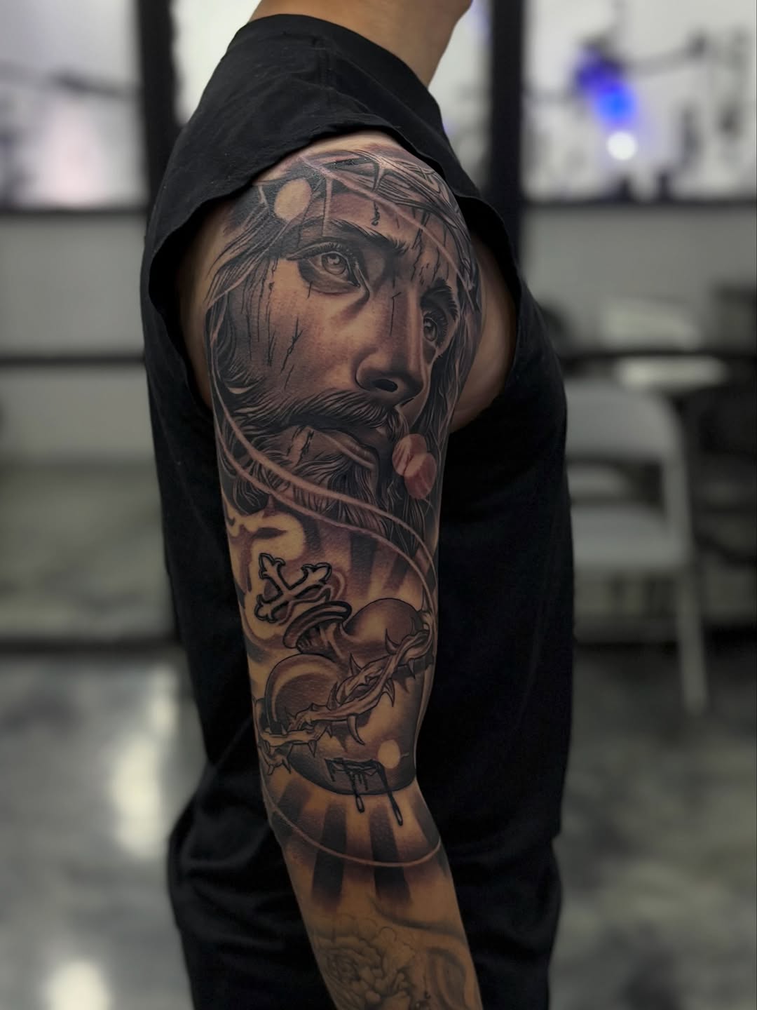 Jesus Christ and Sacred Heart Chicano tattoo on the forearm by Devin