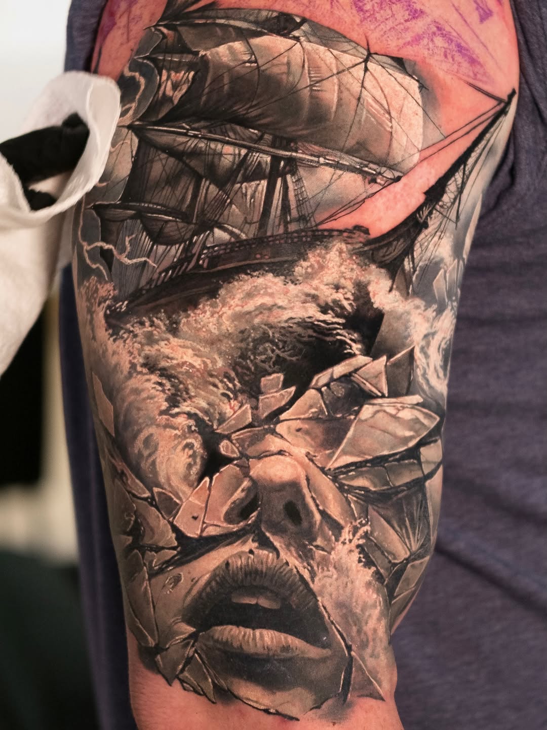 Surrealism tattoo on the forearm by Christopher Powell