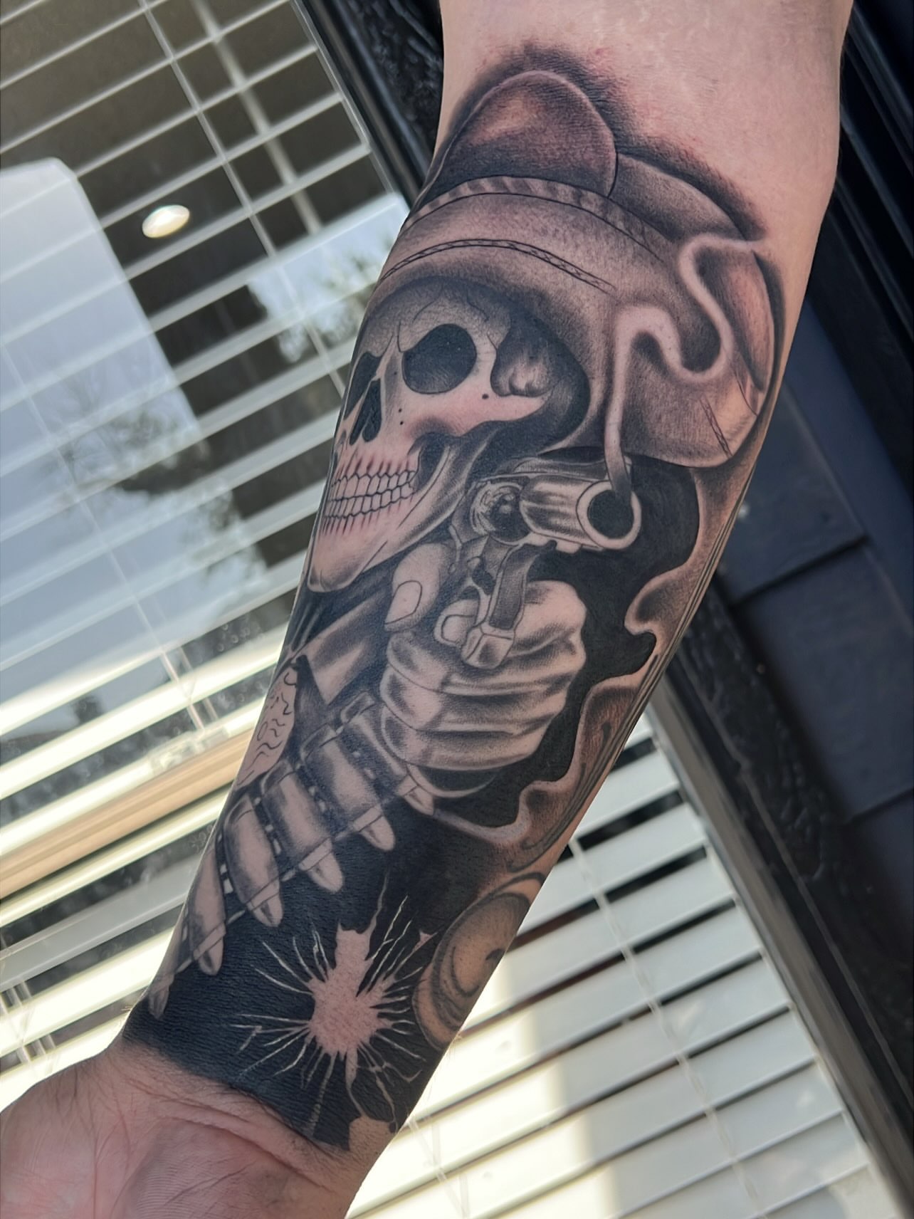 Skull with gun realism tattoo on the forearm by Dallas tx tattoo artist ✝️