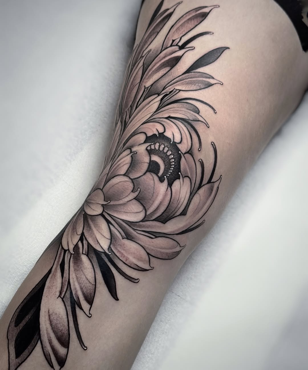 Chrysanthemum flower dotwork tattoo on the forearm by Aitor Arie, Roseville, California