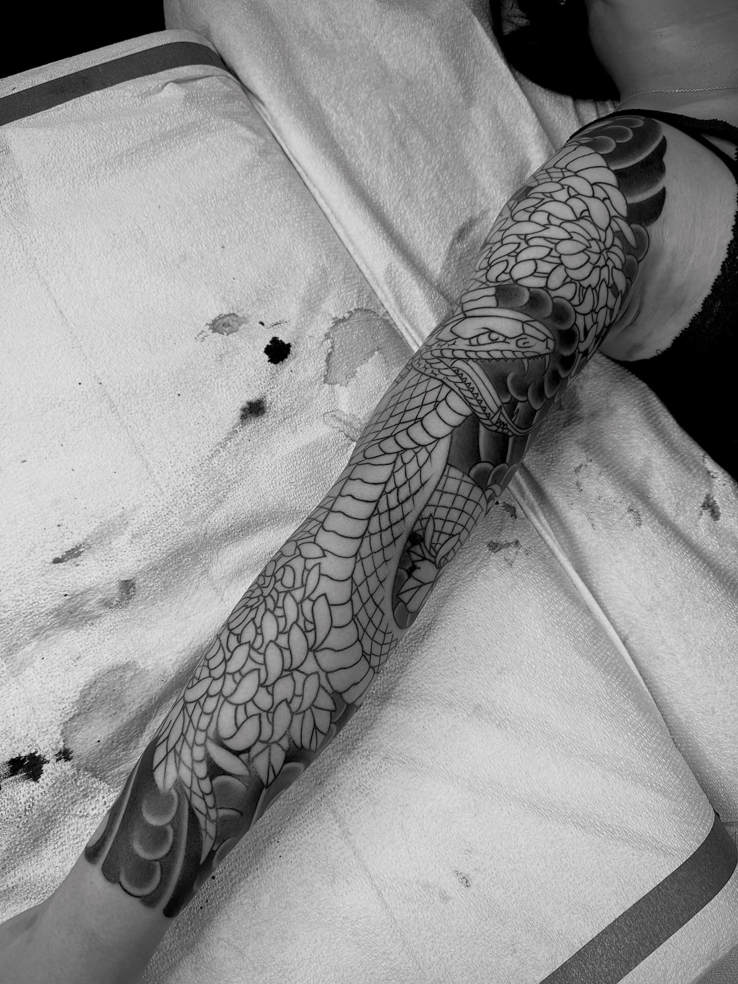 Snake black and grey tattoo on the forearm by Erick Lynch, Cambridge, Massachusetts