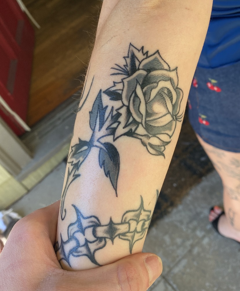 Rose black and grey tattoo on the forearm by Karl Hegwein, Portland, Oregon