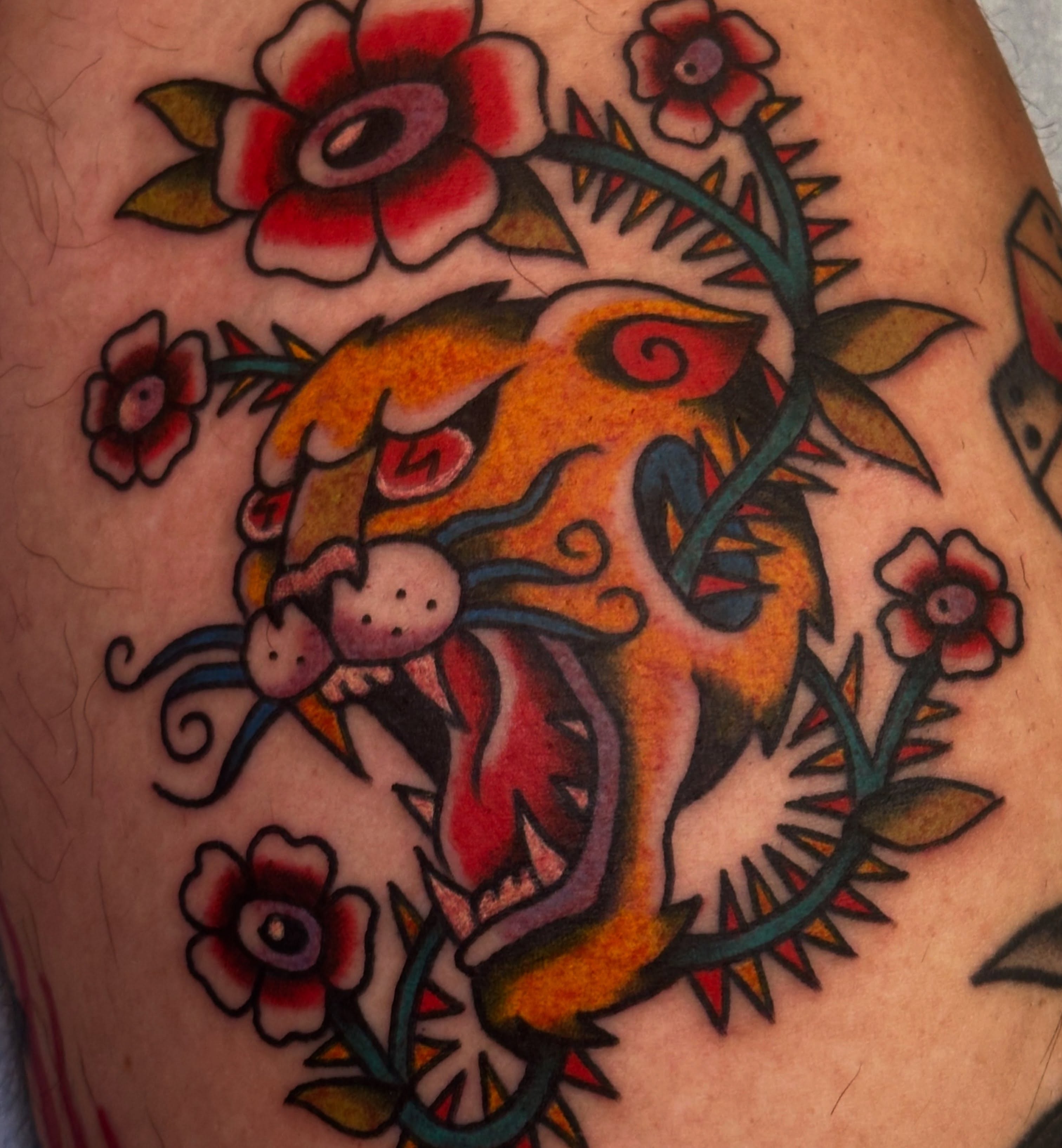 Lion and flowers American traditional tattoo on the thigh by ࿊ Emma Sloan Tattoos ࿊, Austin, Texas