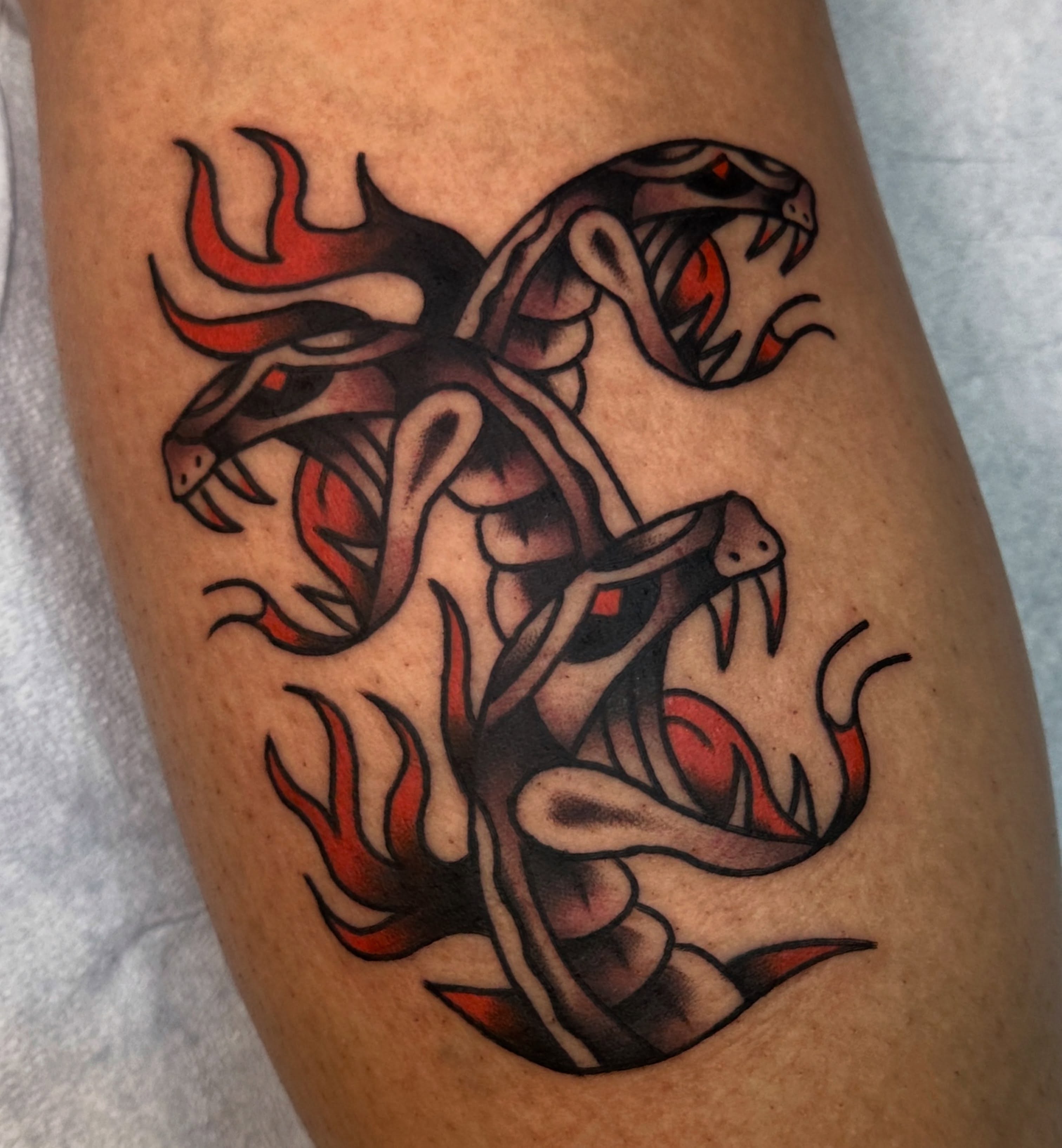 Snakes American traditional tattoo on the thigh by ࿊ Emma Sloan Tattoos ࿊, Austin, Texas