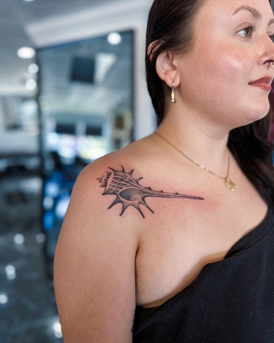 Seashell cyber sigilism tattoo on the shoulder by Elvira Savchuk