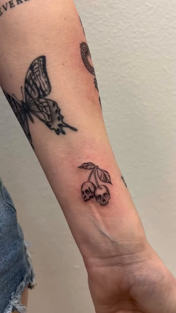 Butterfly and cherries tattoo minimalist tattoo on the forearm by Vanessa ♡ UTAH FINE LINE TATTOO + LIP BLUSH