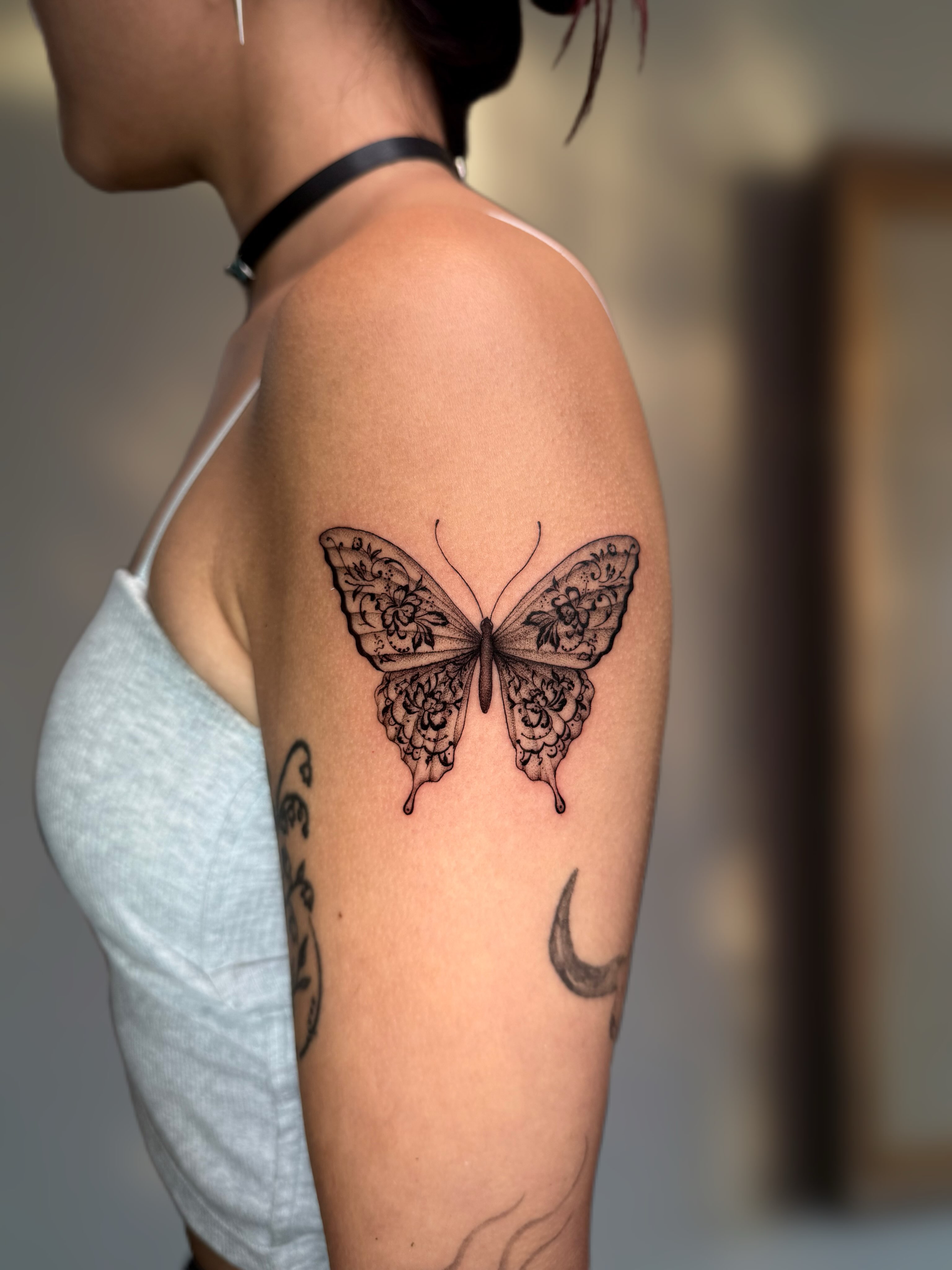 Butterfly black and grey tattoo on the forearm by Ingrid Rojas