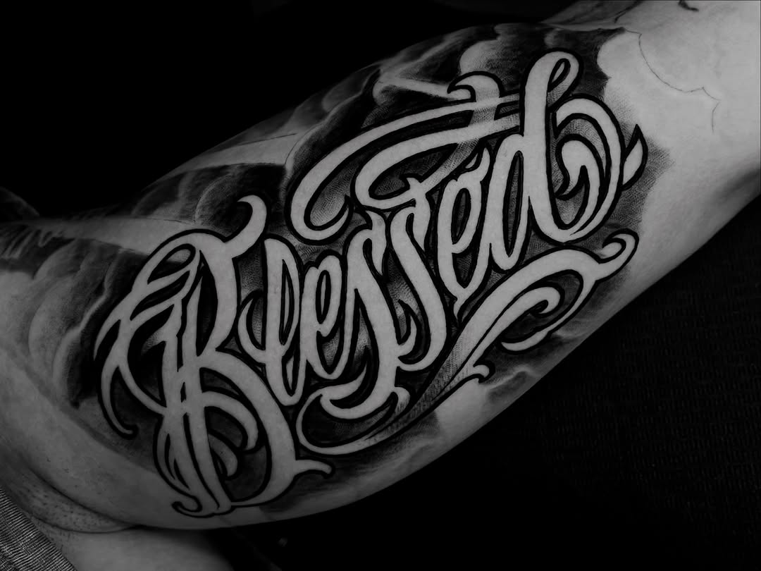 Blessed lettering Chicano tattoo on the forearm by Tattoo Artist