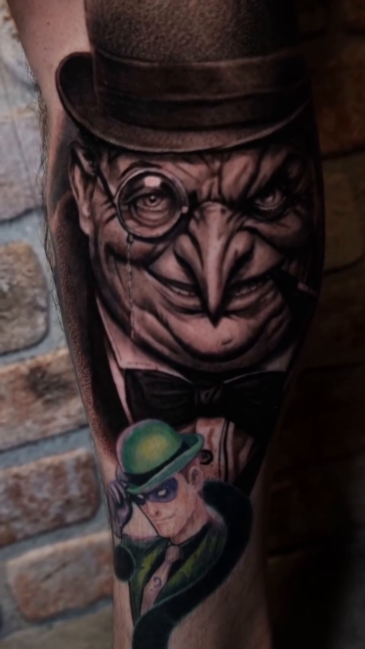 The Penguin and The Riddler realism tattoo on the forearm by Ana Fajardo