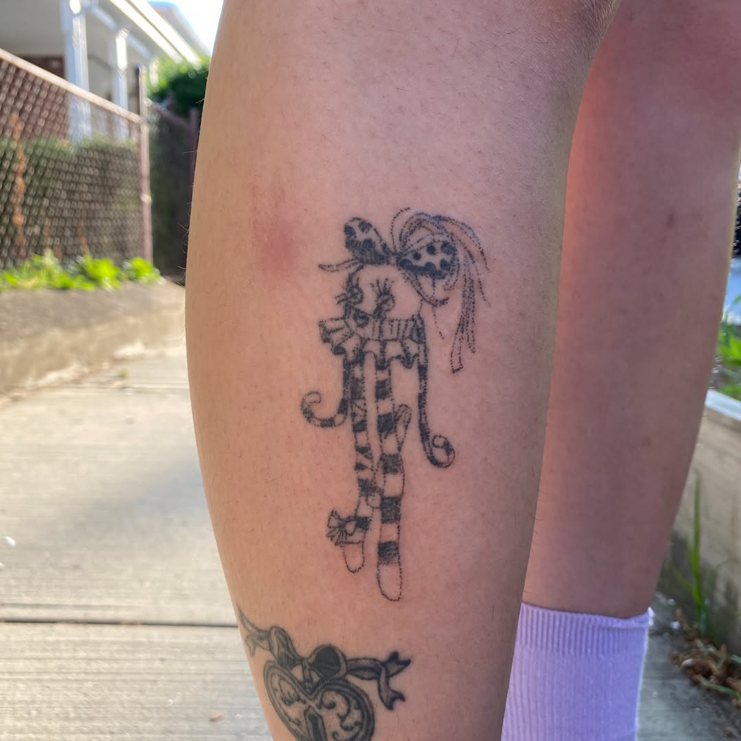 Cartoon cat character minimalist tattoo on the forearm by @feverfeverish