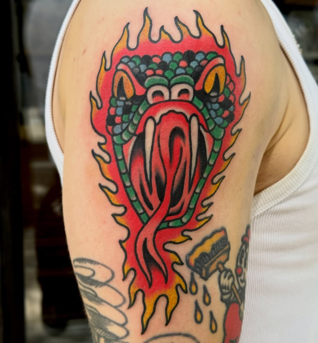 Dragon American traditional tattoo on the shoulder by Eli Bernal