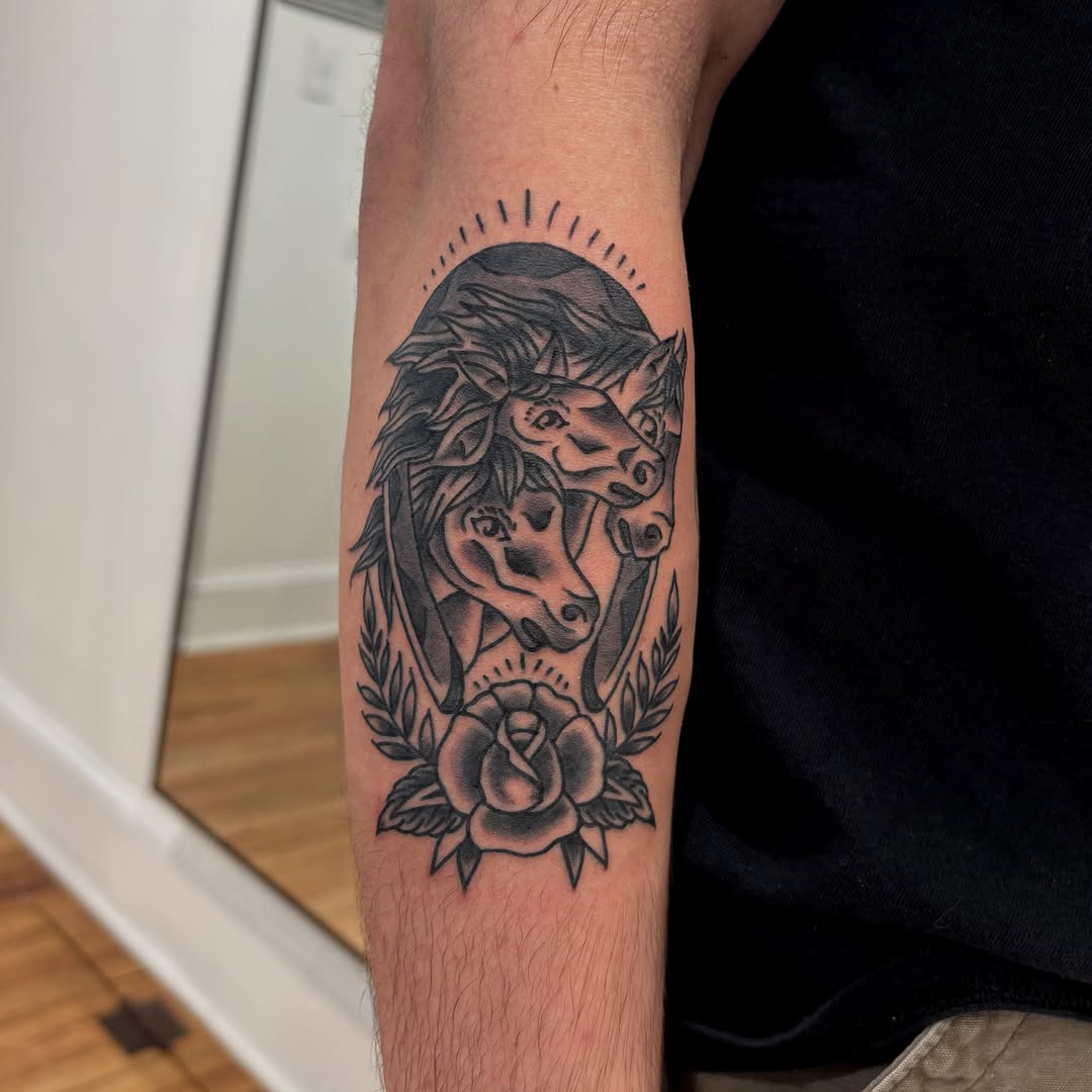 Horses and rose black and grey tattoo on the forearm by Evan Bisso, Philadelphia, Pennsylvania