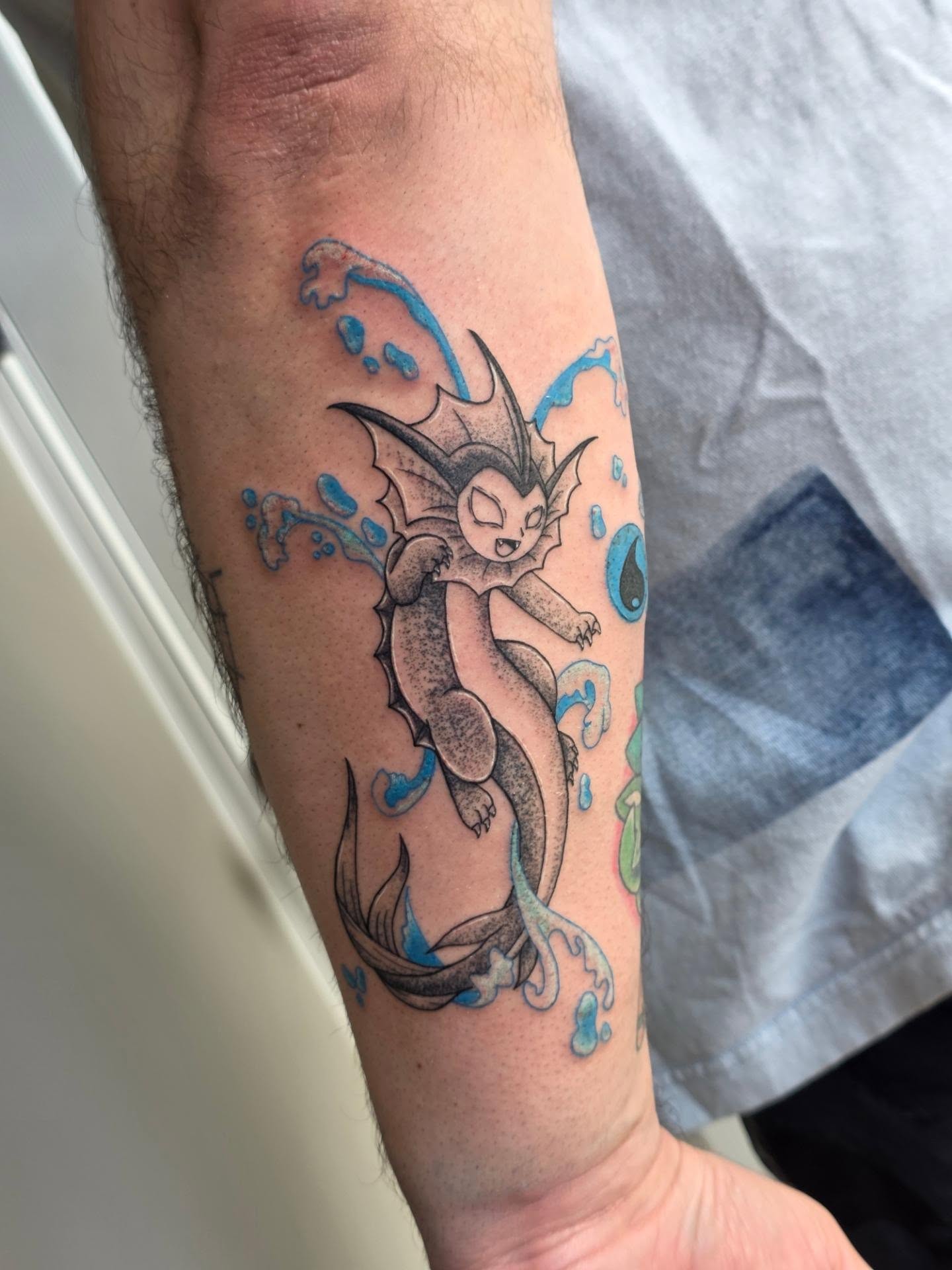 Muk new school tattoo on the forearm by Wray Saulsberry