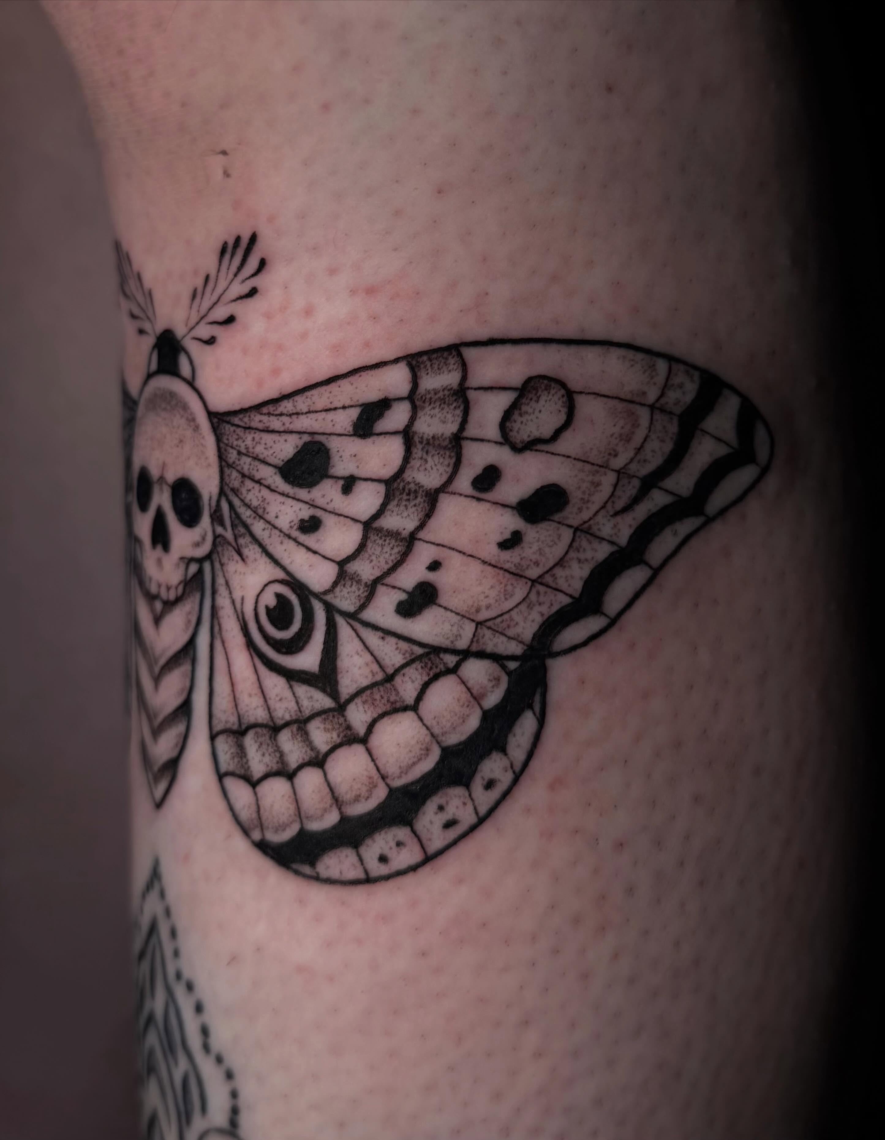 Butterfly with skull dotwork tattoo on the forearm by Olivia Whan Tattoos🌙