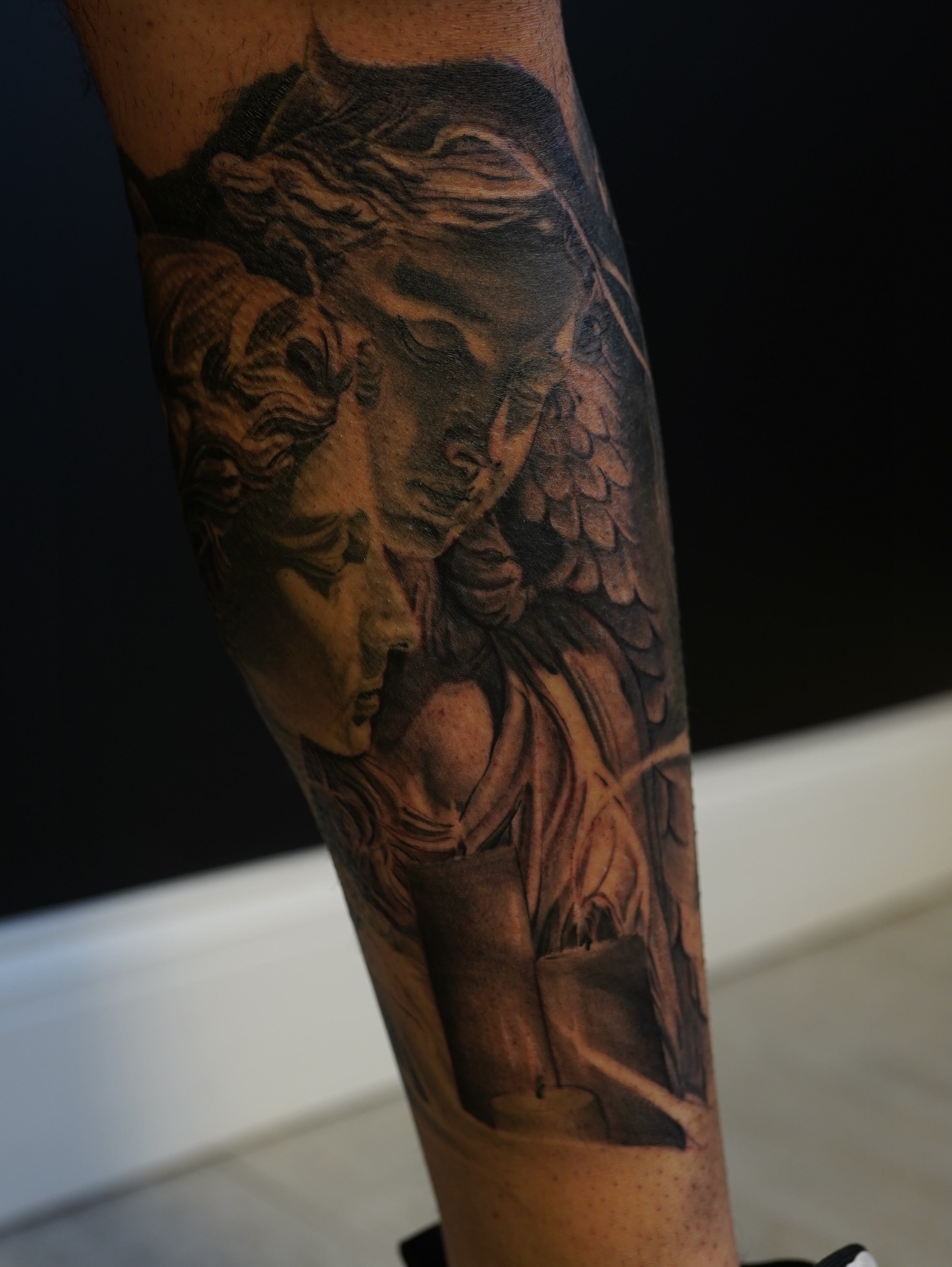 Angel realism tattoo on the forearm by Eric RudeInk