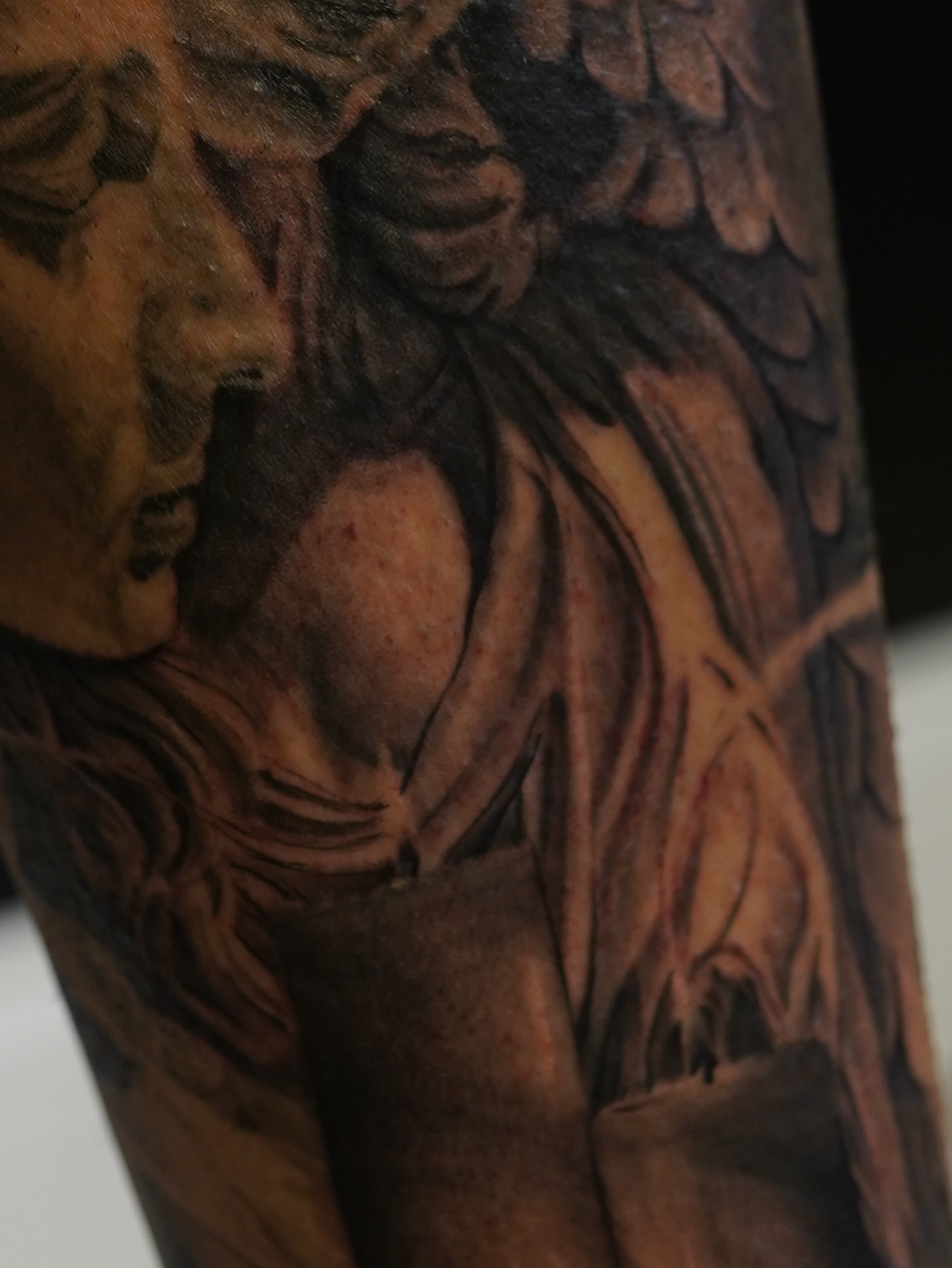 Angel black and grey tattoo on the forearm by Eric RudeInk