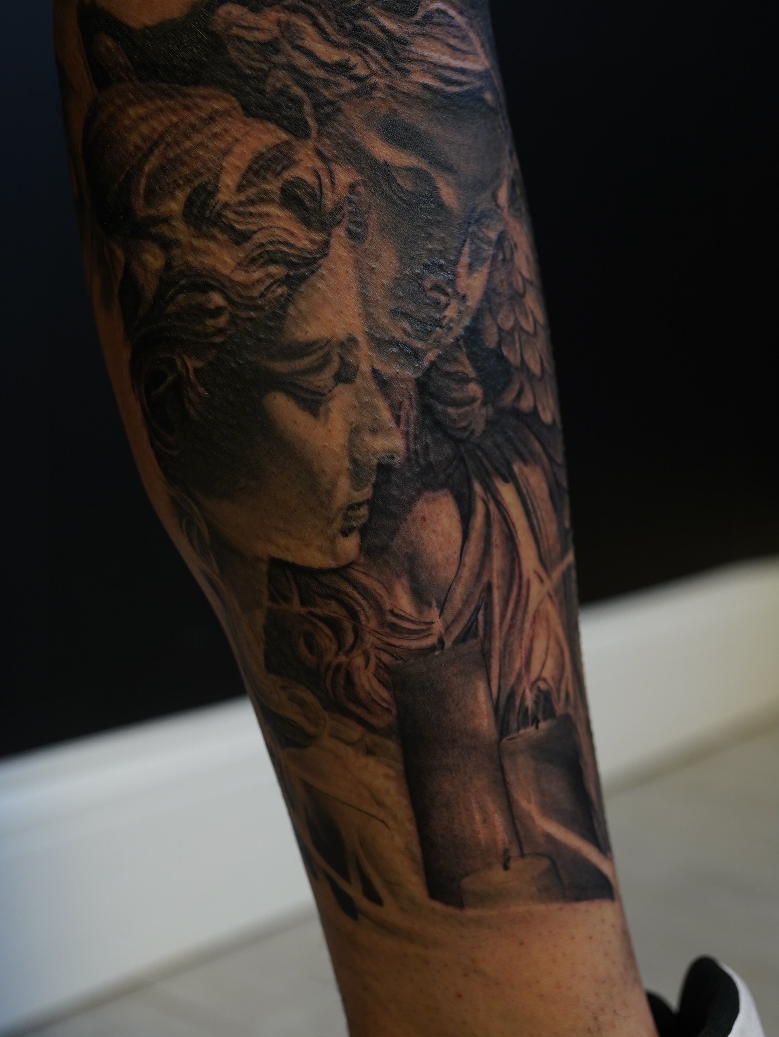 Medusa realism tattoo on the forearm by Eric RudeInk