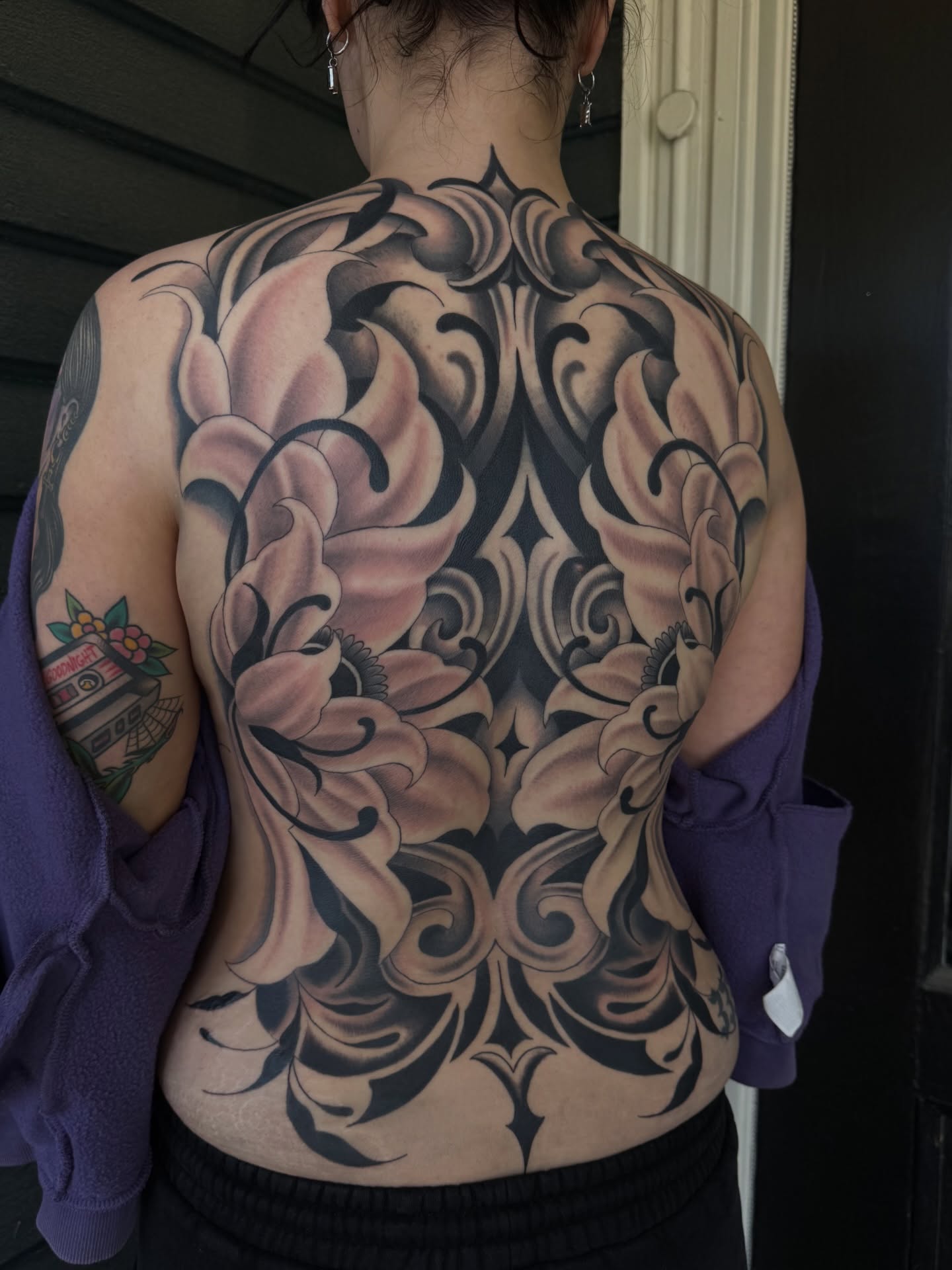 Floral ornamental tattoo on the back by Chloe Marie
