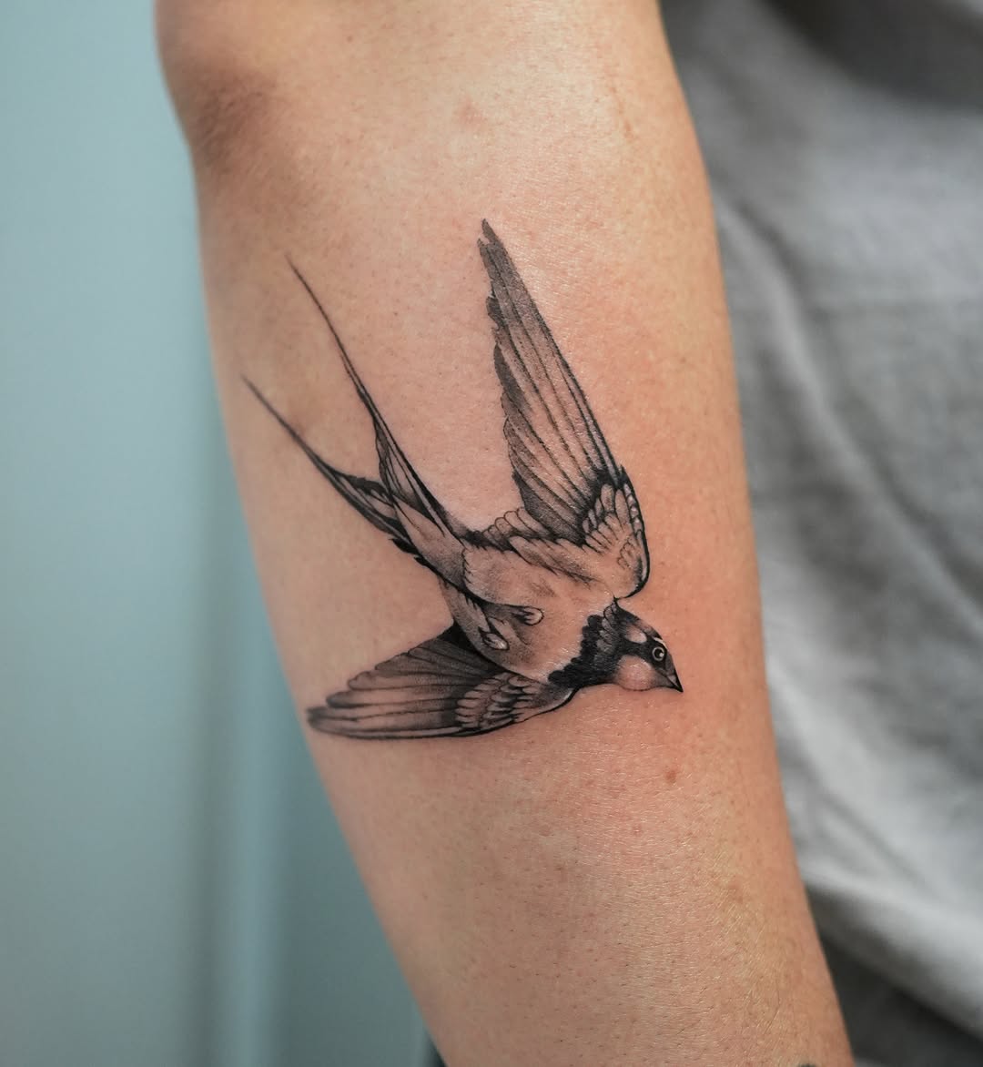 Swallow realism tattoo on the forearm by Hery Anwar