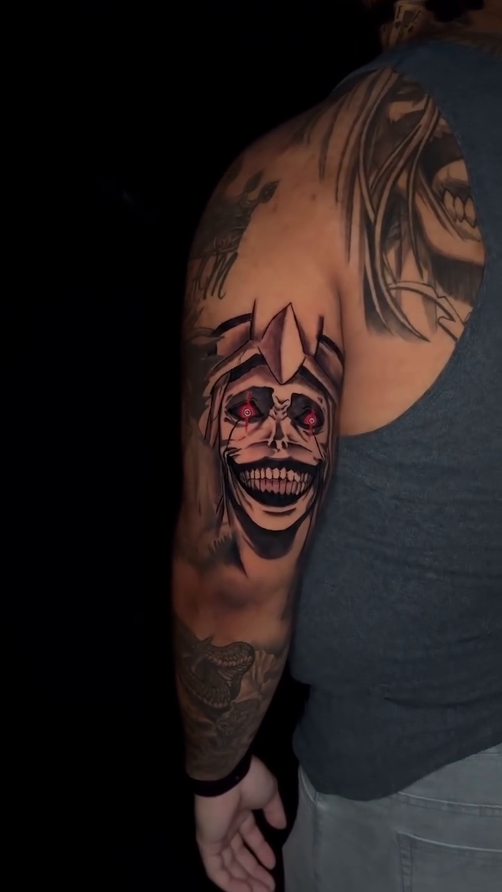 Creepy clown face dark realism tattoo by Mariyah Rhae Lewis