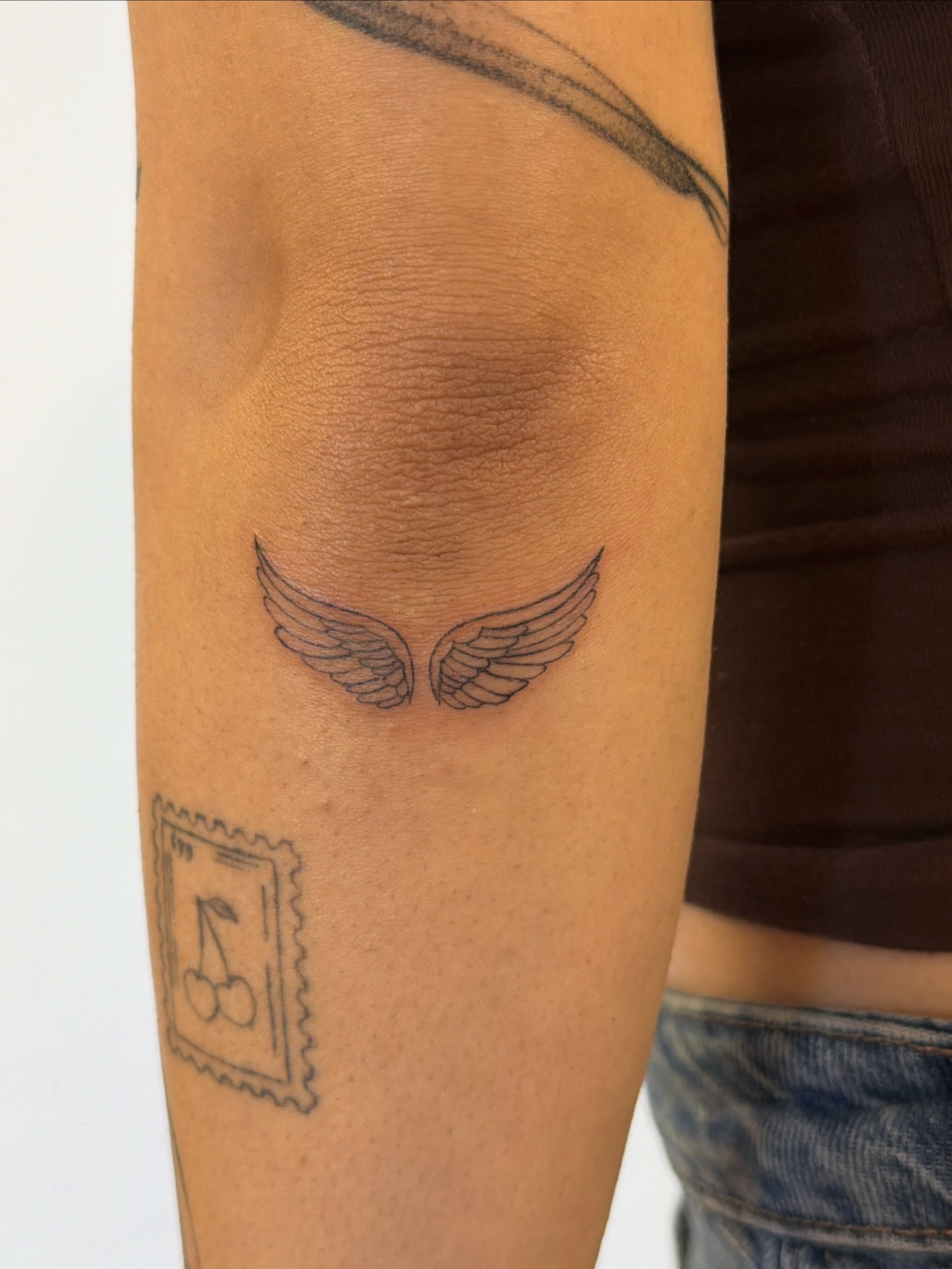 Wings black and grey tattoo on the forearm by Sienna (jj) Hicks