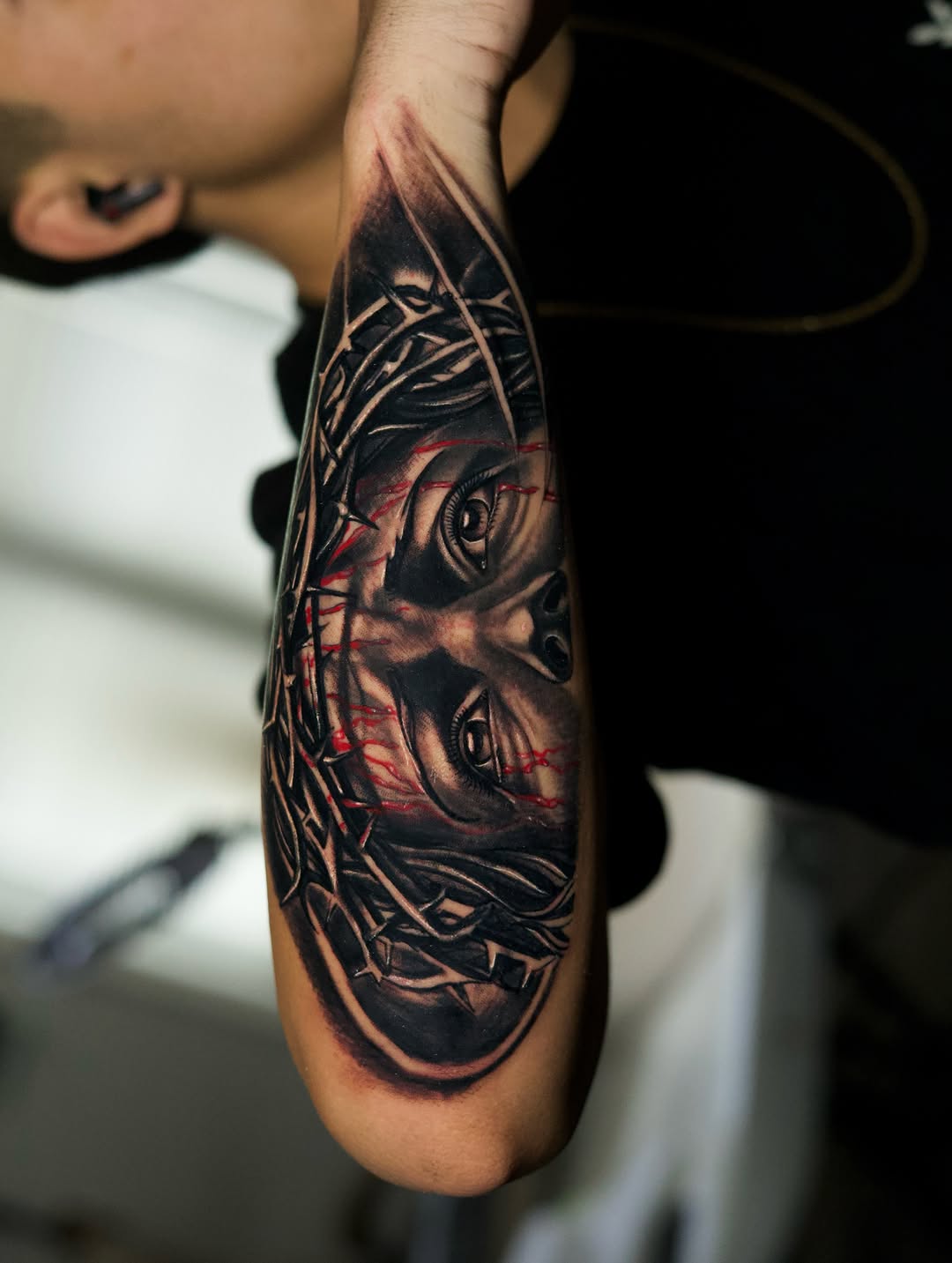 Jesus Christ with crown of thorns realism tattoo on the forearm by Insight Ink Tattoo