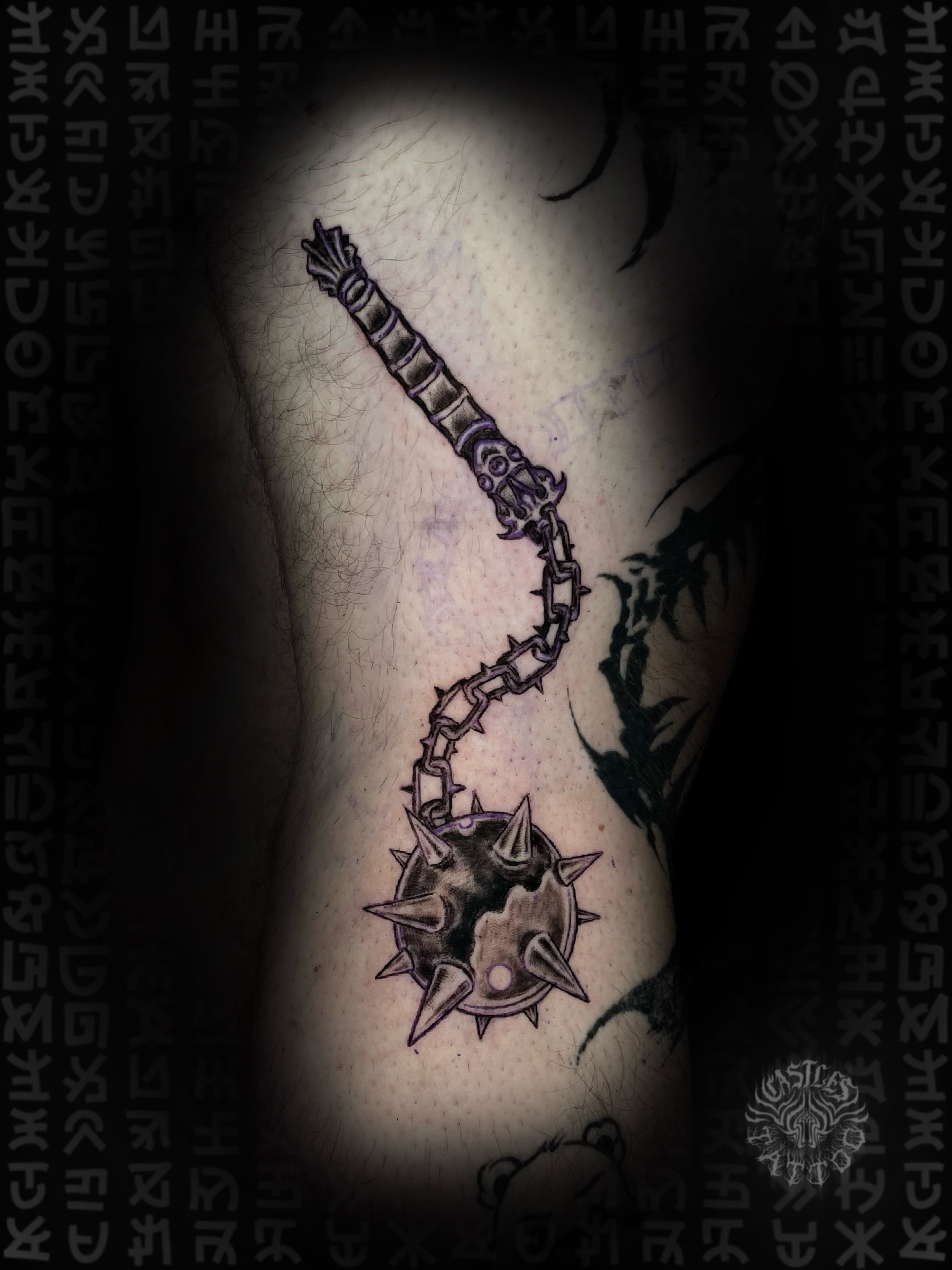 Spiked weapon black and grey tattoo on the forearm by Erin Portland Tattoo Artist
