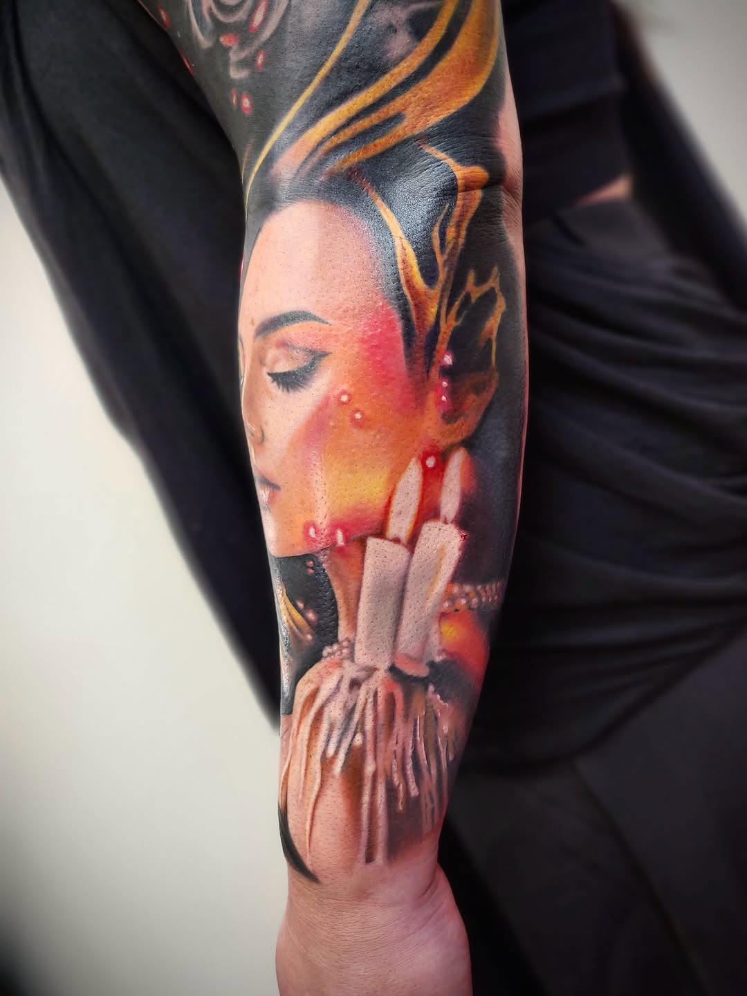 Woman's face with candles neo-traditional tattoo on the forearm by Su Kang