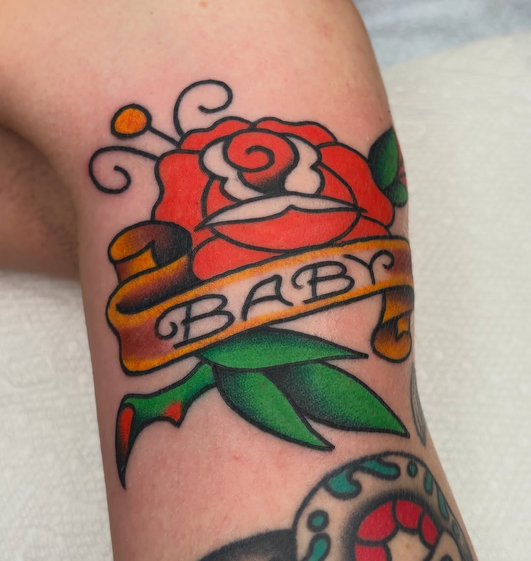 Rose with banner American traditional tattoo on the forearm by ๐๐๐ฏ๐ข๐ซ