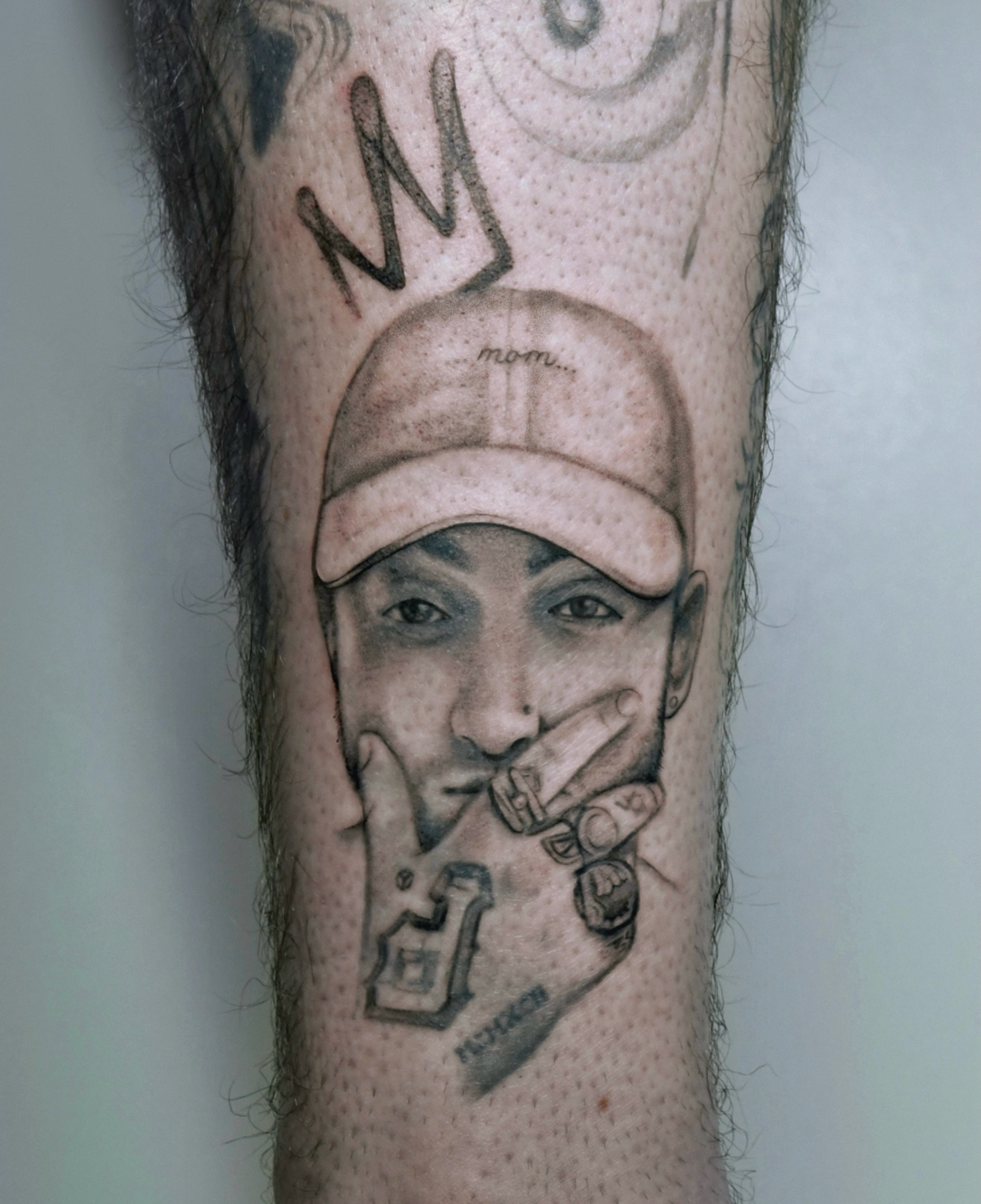 Eminem portrait realism tattoo on the forearm by Milk Tattoos 🇸🇻🇪🇸