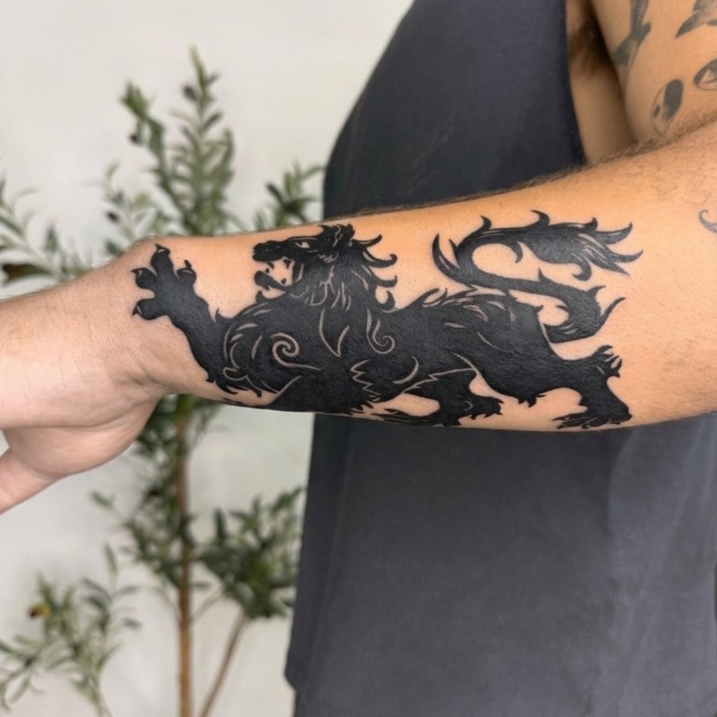 Heraldic lion Japanese tattoo on the forearm by Joey tattoo