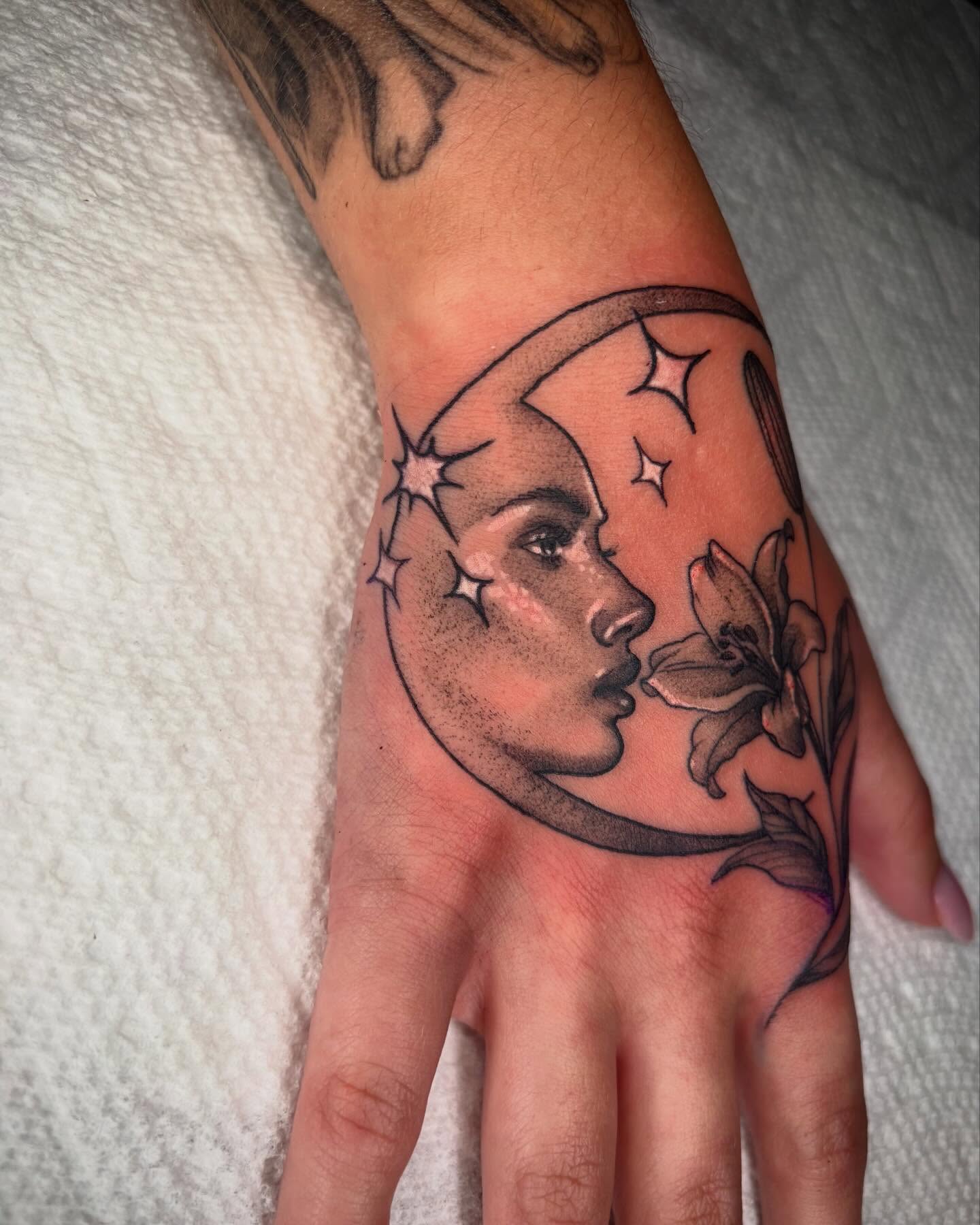 Moon and woman realism tattoo on the hand by Emily Falkowski