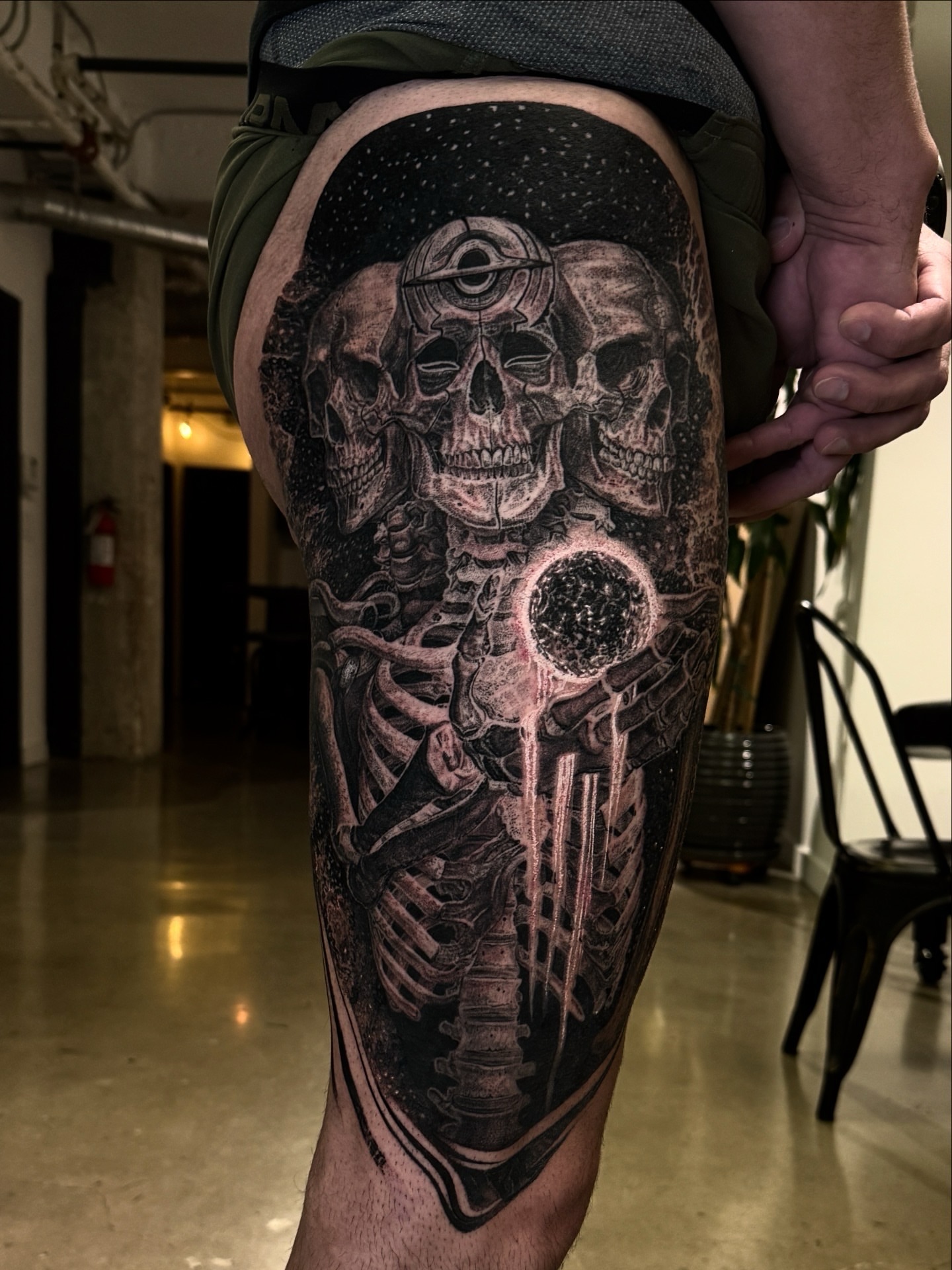 Astronaut skull realism tattoo on the thigh by Dan Sprague