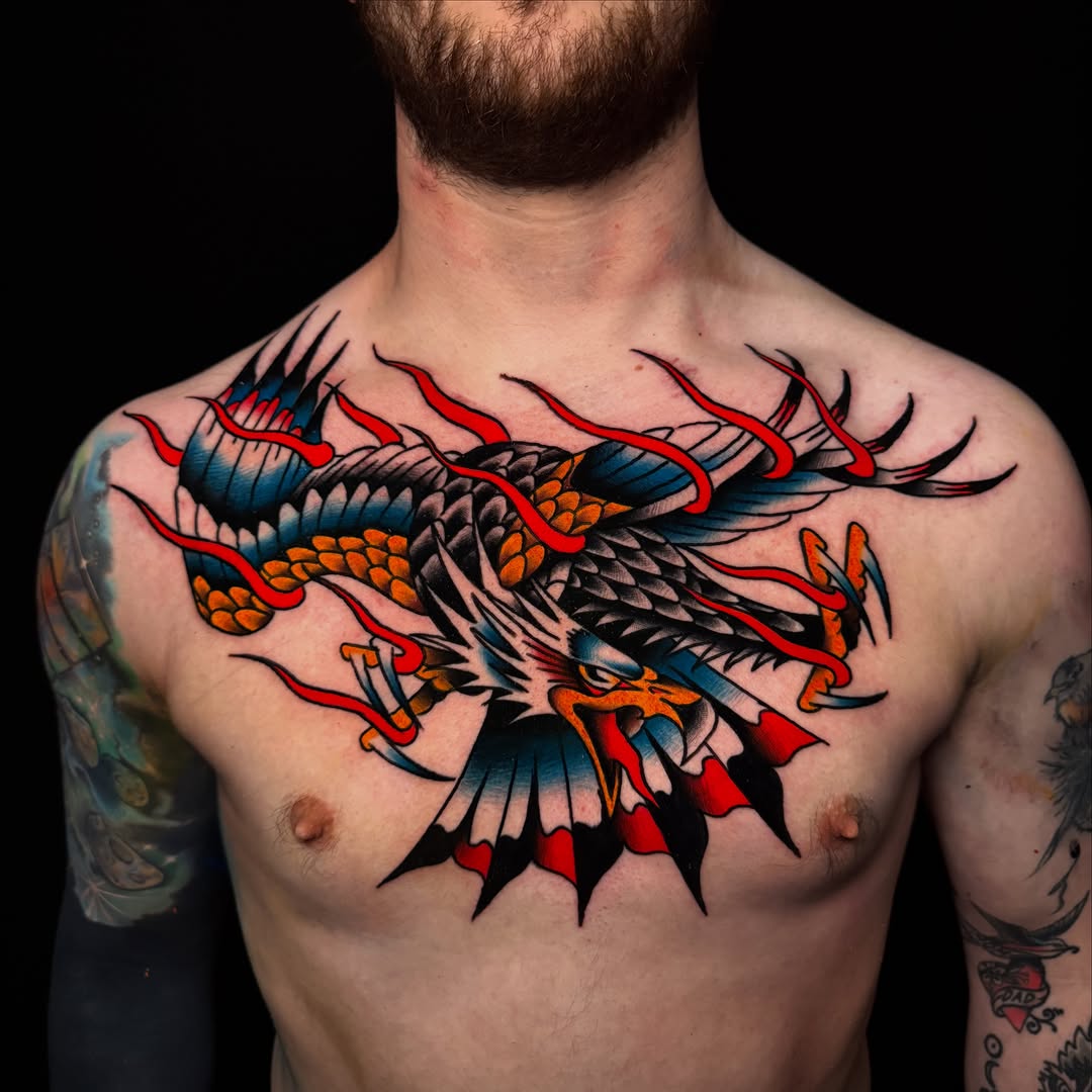 Eagle with flames realism tattoo on the chest by Nate Masi