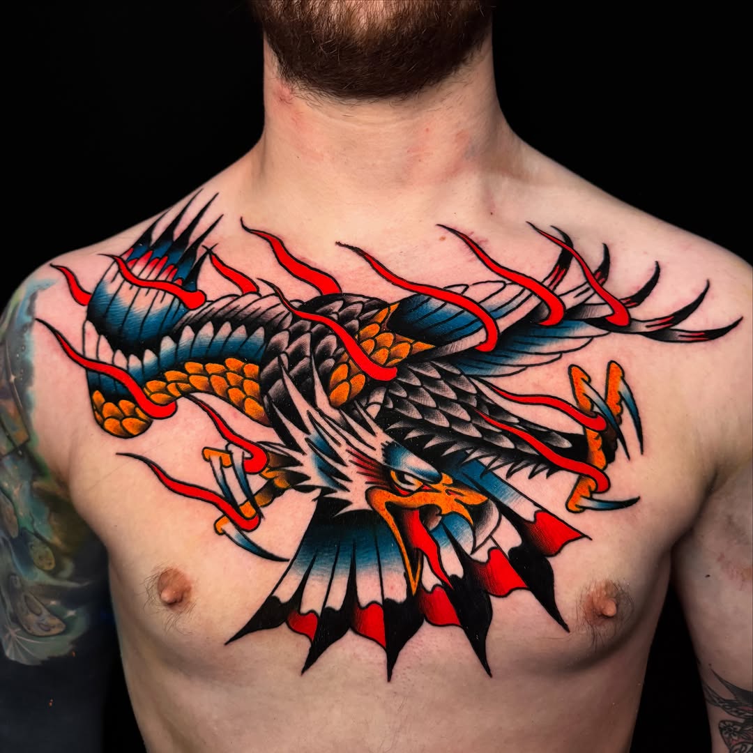 Eagle with flames American traditional tattoo on the chest by Nate Masi