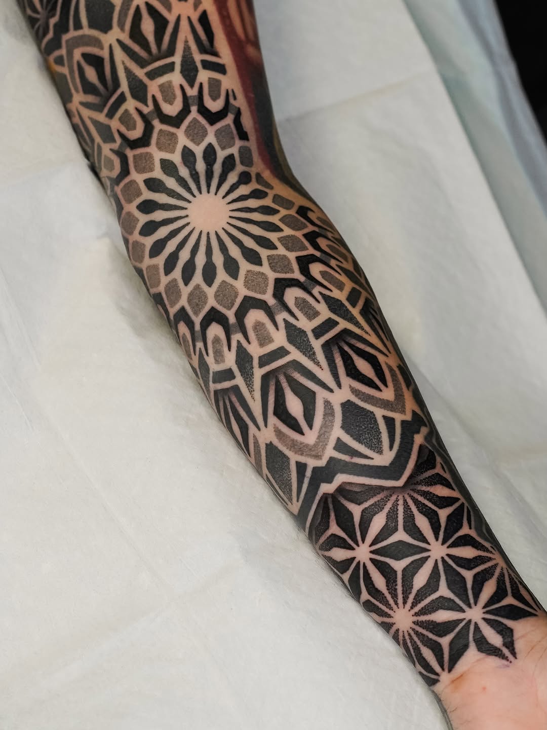 Tattoo by @rjxdots — geometric, dotwork