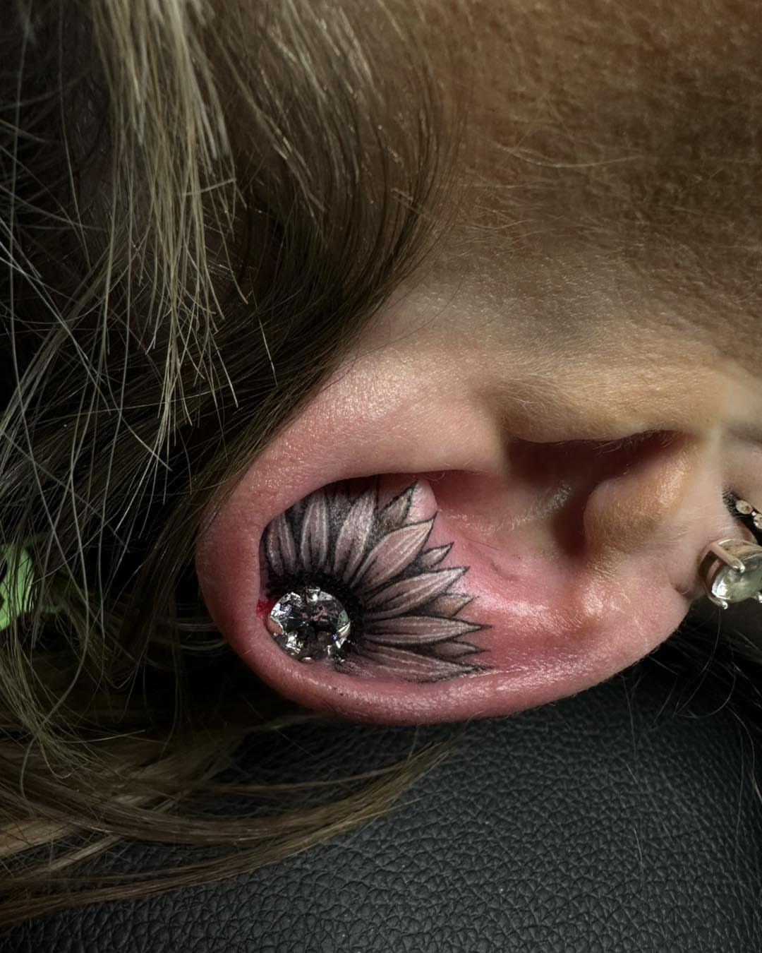 Sunflower black and grey tattoo by Sarah Nash