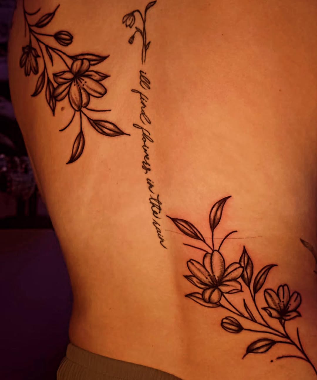 Floral vine with script tattoo on the thigh by Karley Michelle Moody