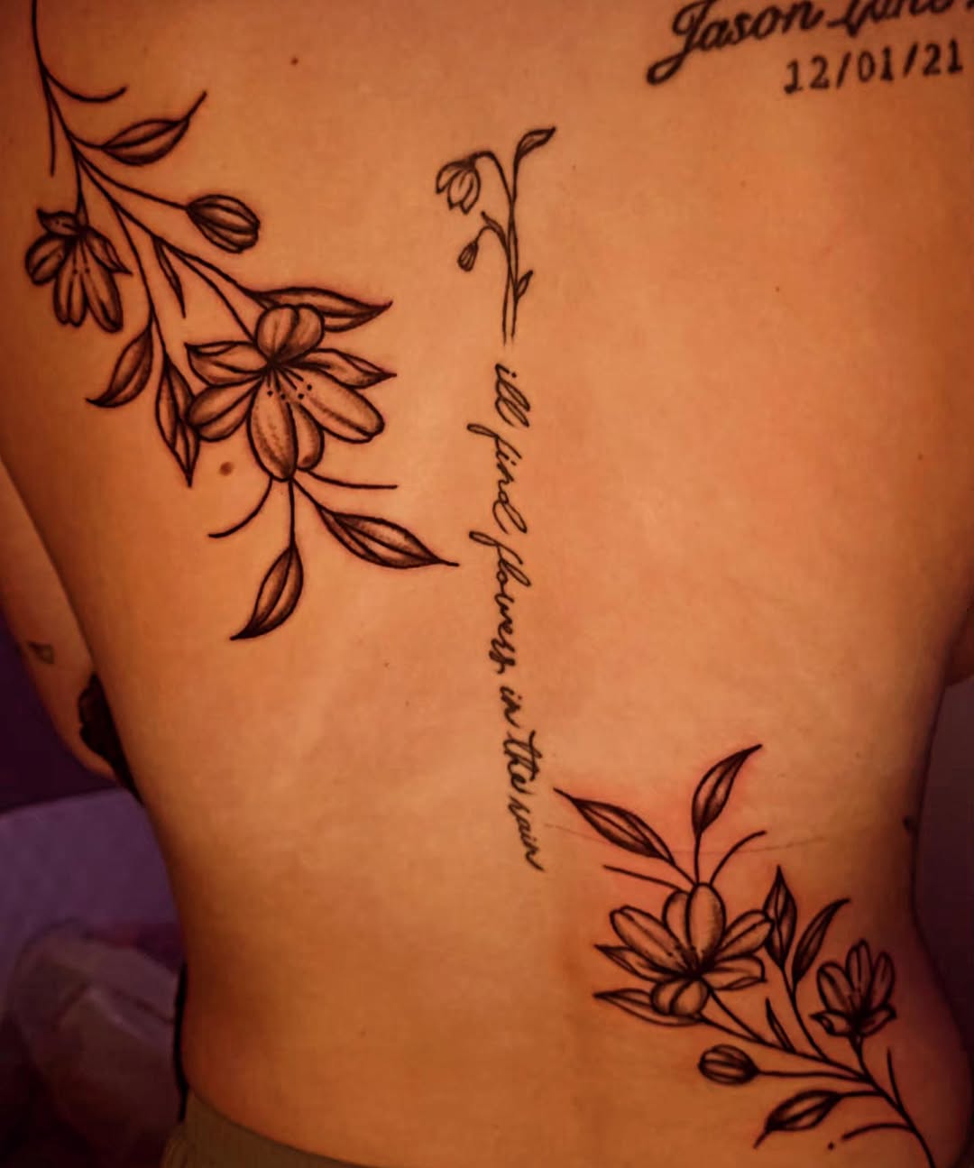 Floral branch with script blackwork tattoo on the back by Karley Michelle Moody