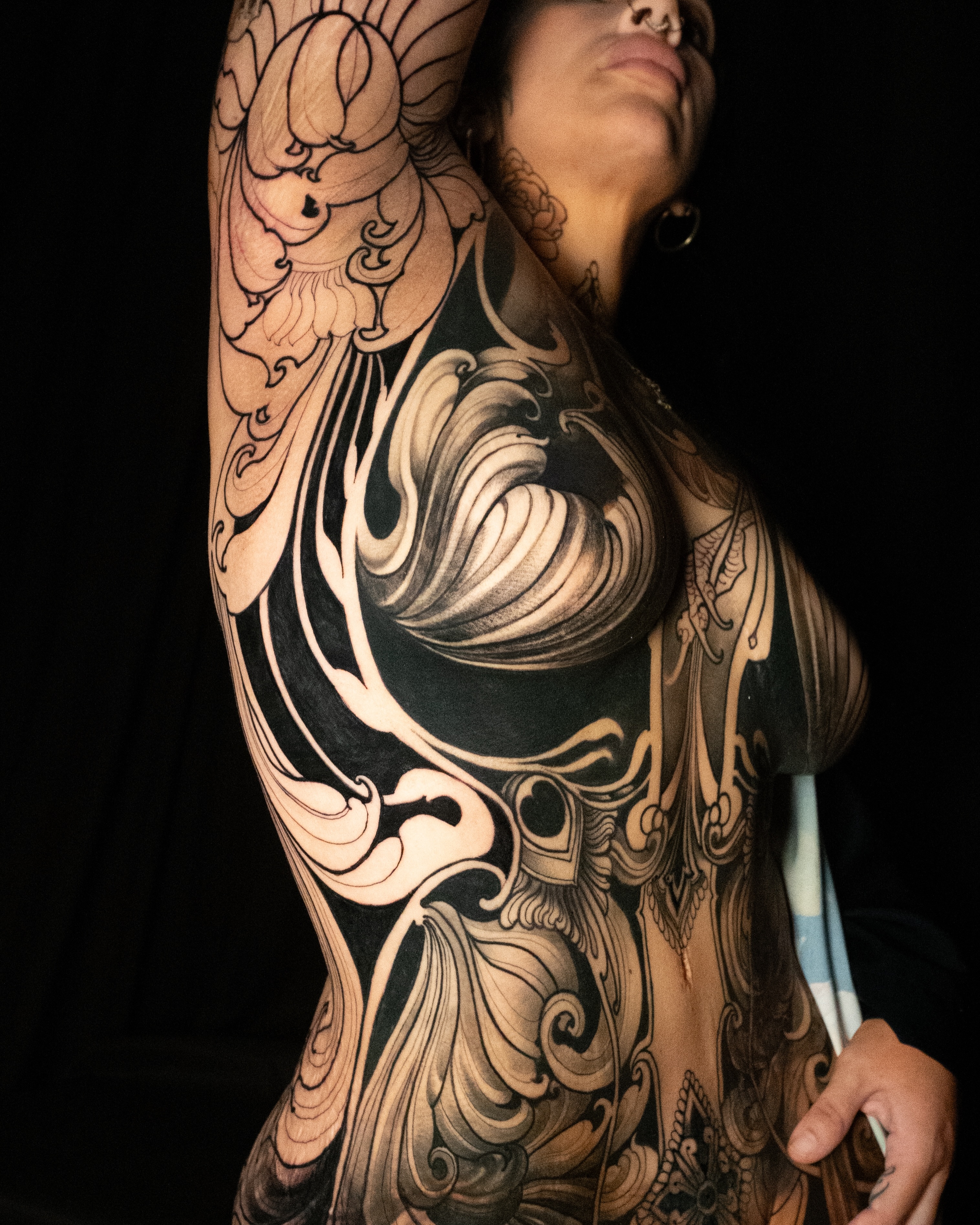Wave black and grey tattoo on the chest by Lorena Borges Gomes