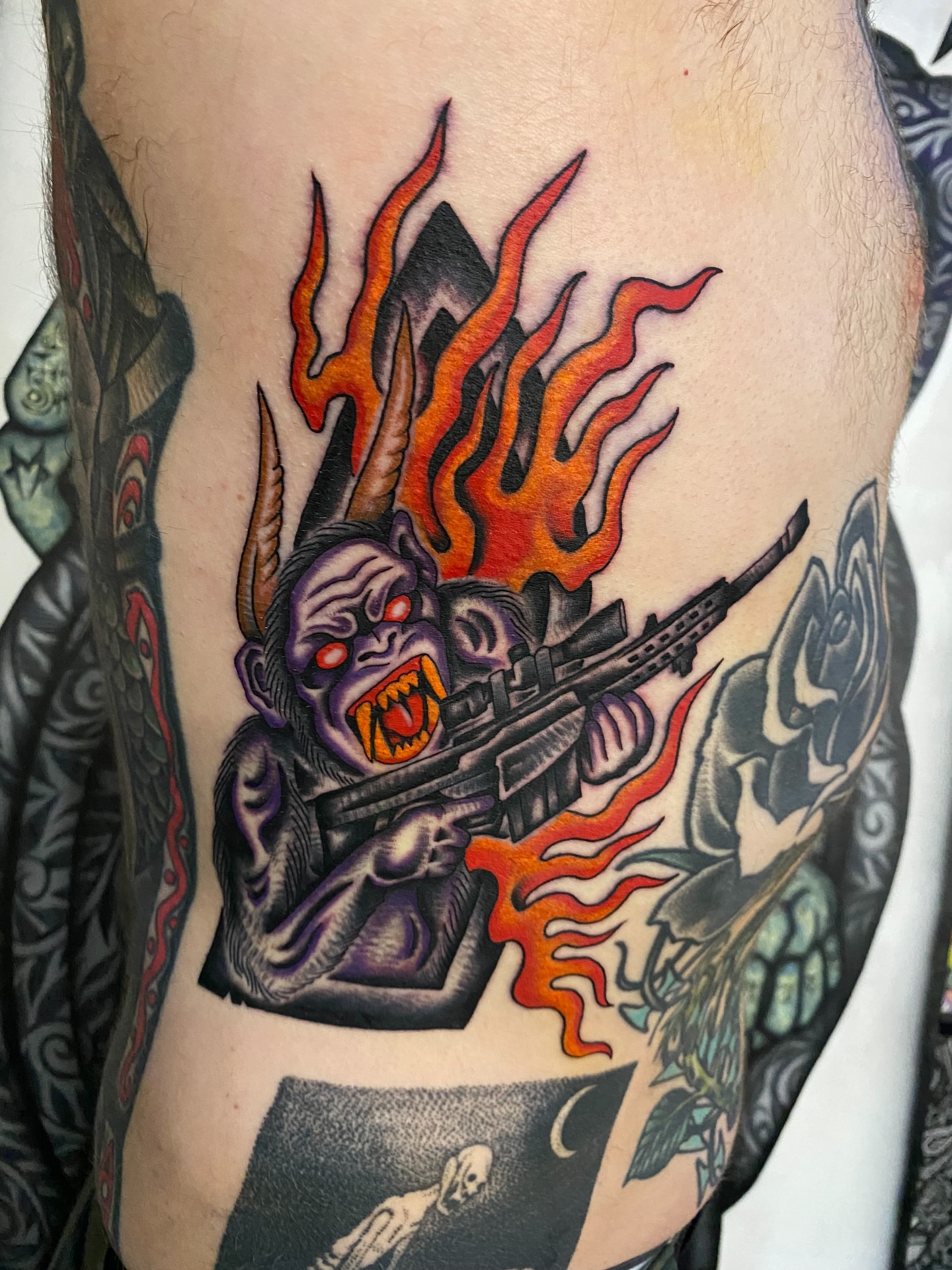 Demon with gun American traditional tattoo on the thigh by sean drennen