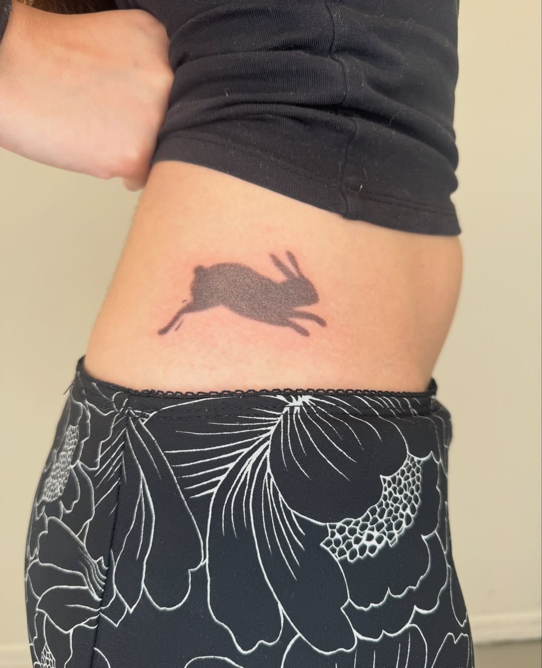 Rabbit black and grey tattoo on the thigh by Monica Reynolds