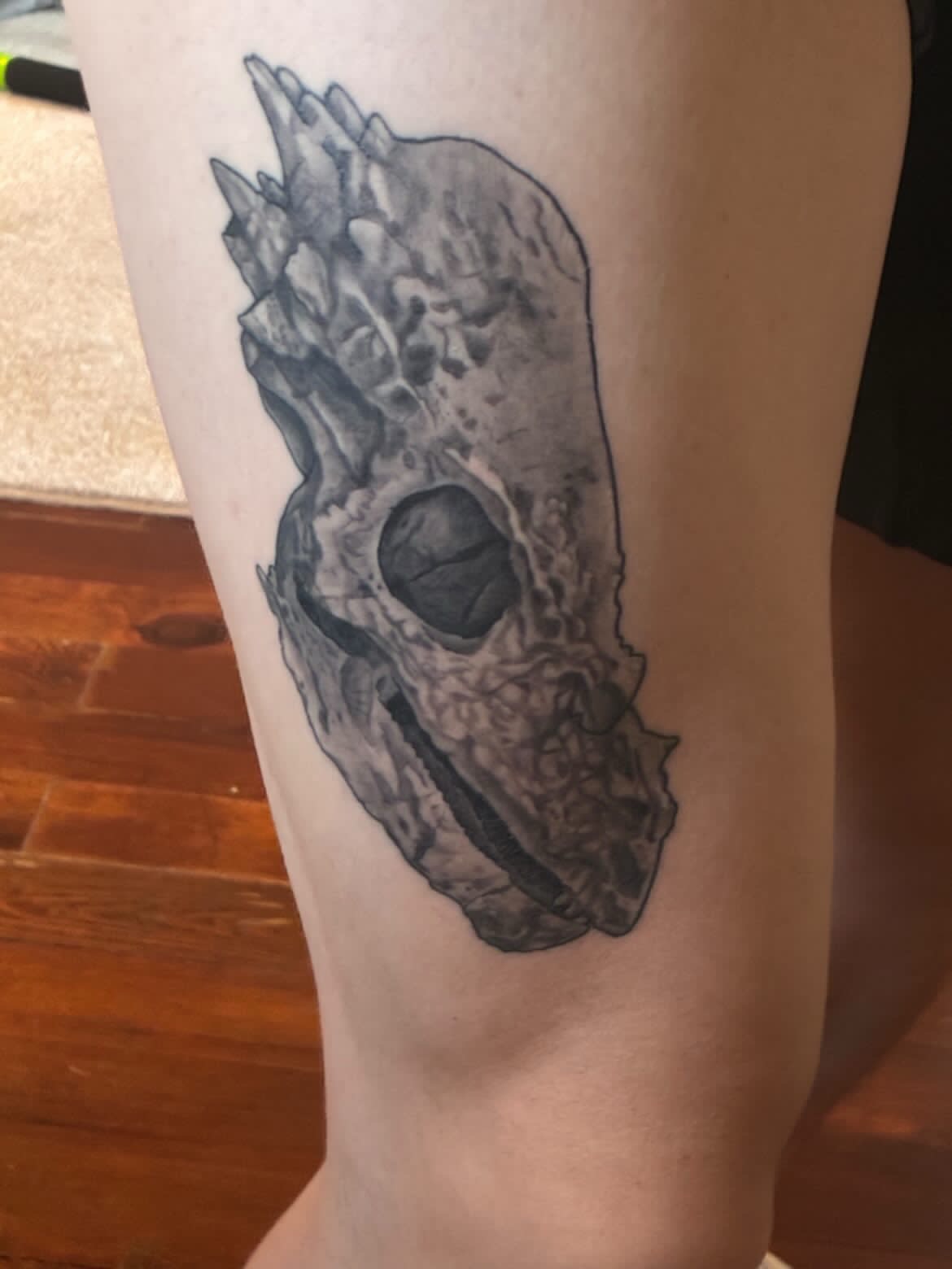 Skull black and grey tattoo on the forearm by Bekah Smith