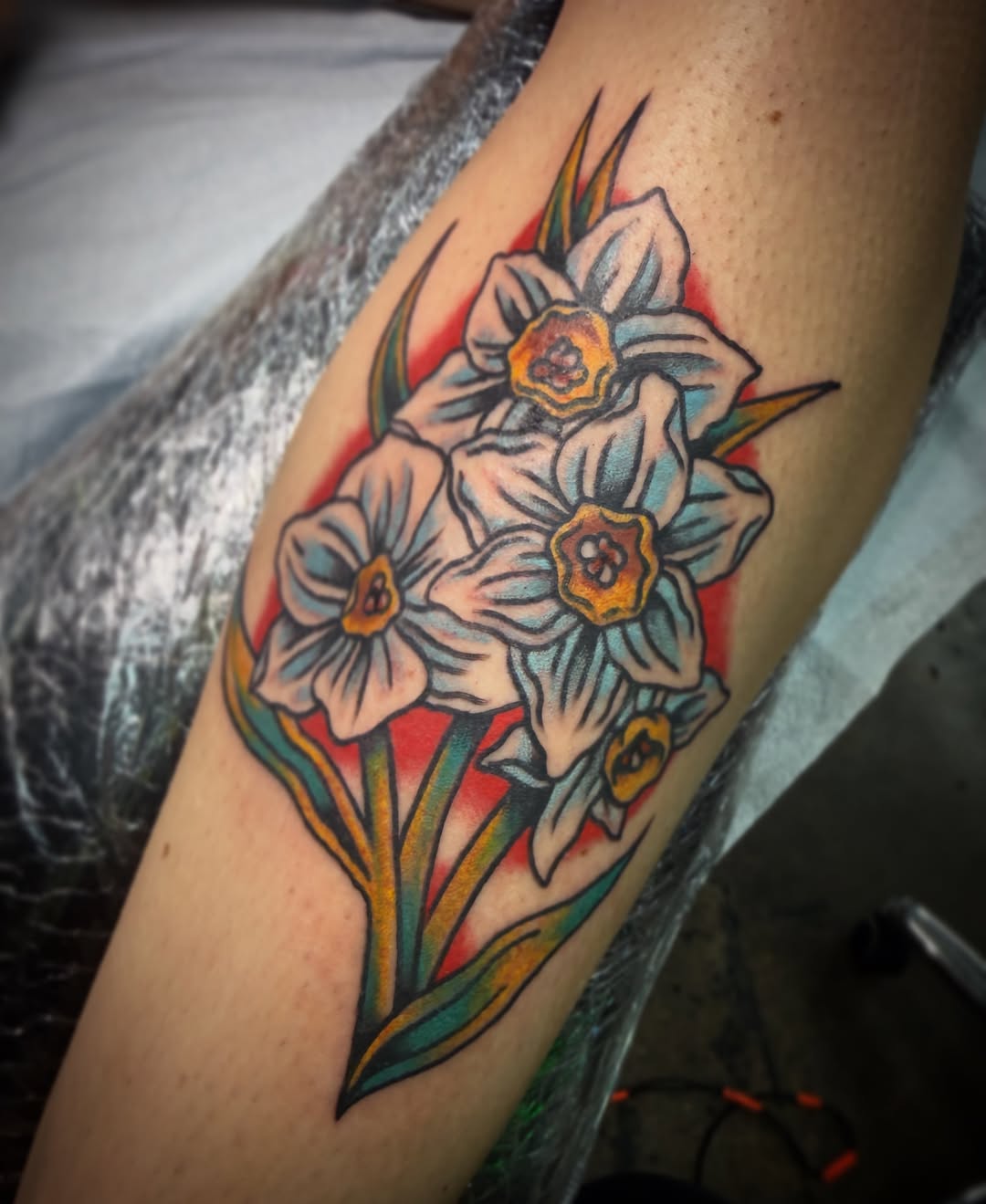 Daffodils American traditional tattoo on the forearm by Austin Liebst, Wichita, Kansas