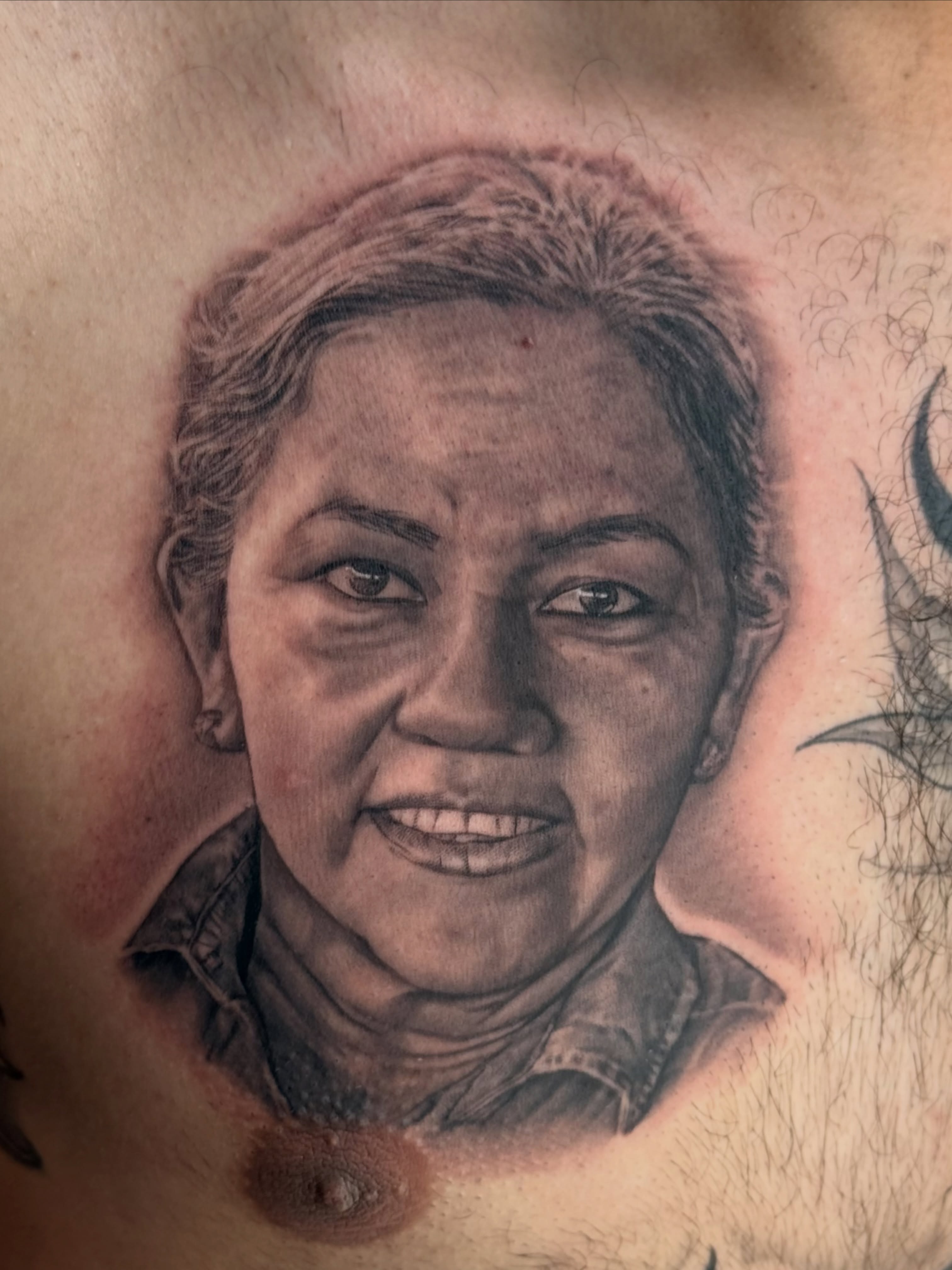 Portrait realism tattoo on the chest by Gilberto Flores Nava