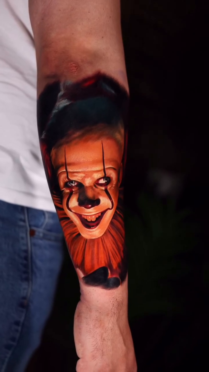 Pennywise the clown realism tattoo on the forearm by Alex Moro