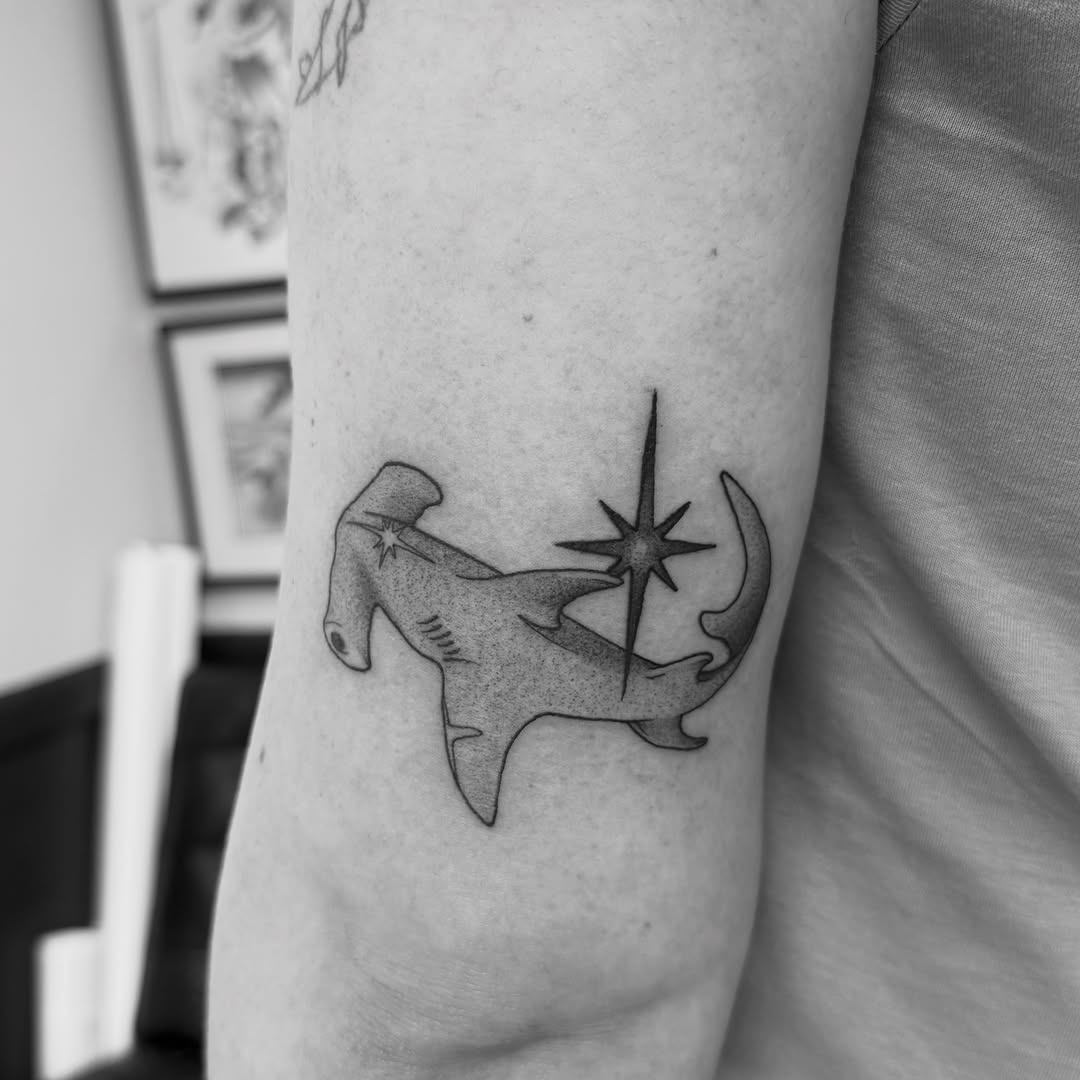 Hammerhead shark with star fine line tattoo on the forearm by Taytum Marsing, Salt Lake City, Utah